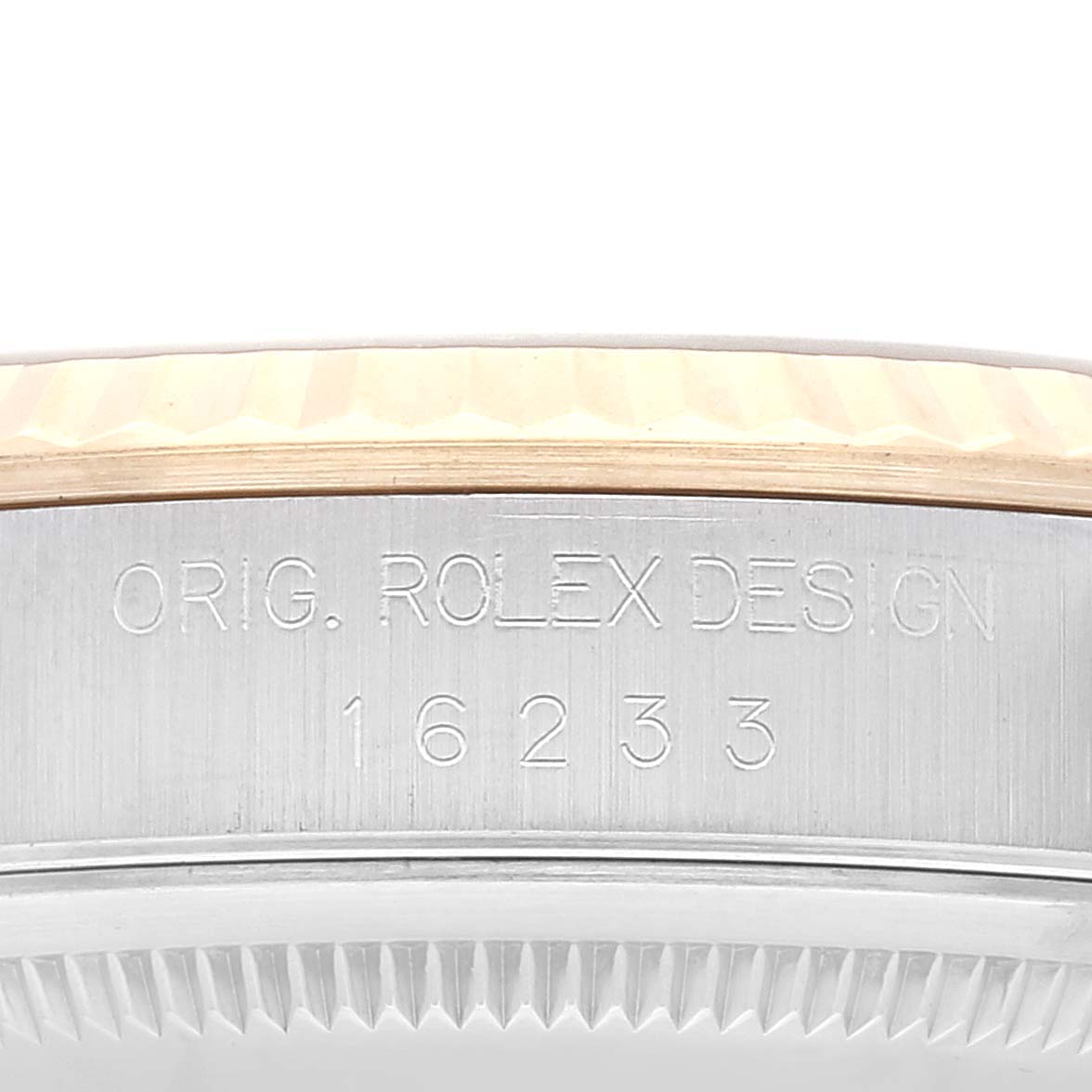 The image shows a close-up of the Rolex Datejust 16233 Men's Steel and Gold (two tone) Grey Dial 16233 Men's Steel and Gold (two tone) Grey Dial model's case side, displaying the "ORIG. ROLEX DESIGN" engraving and model number 16233.