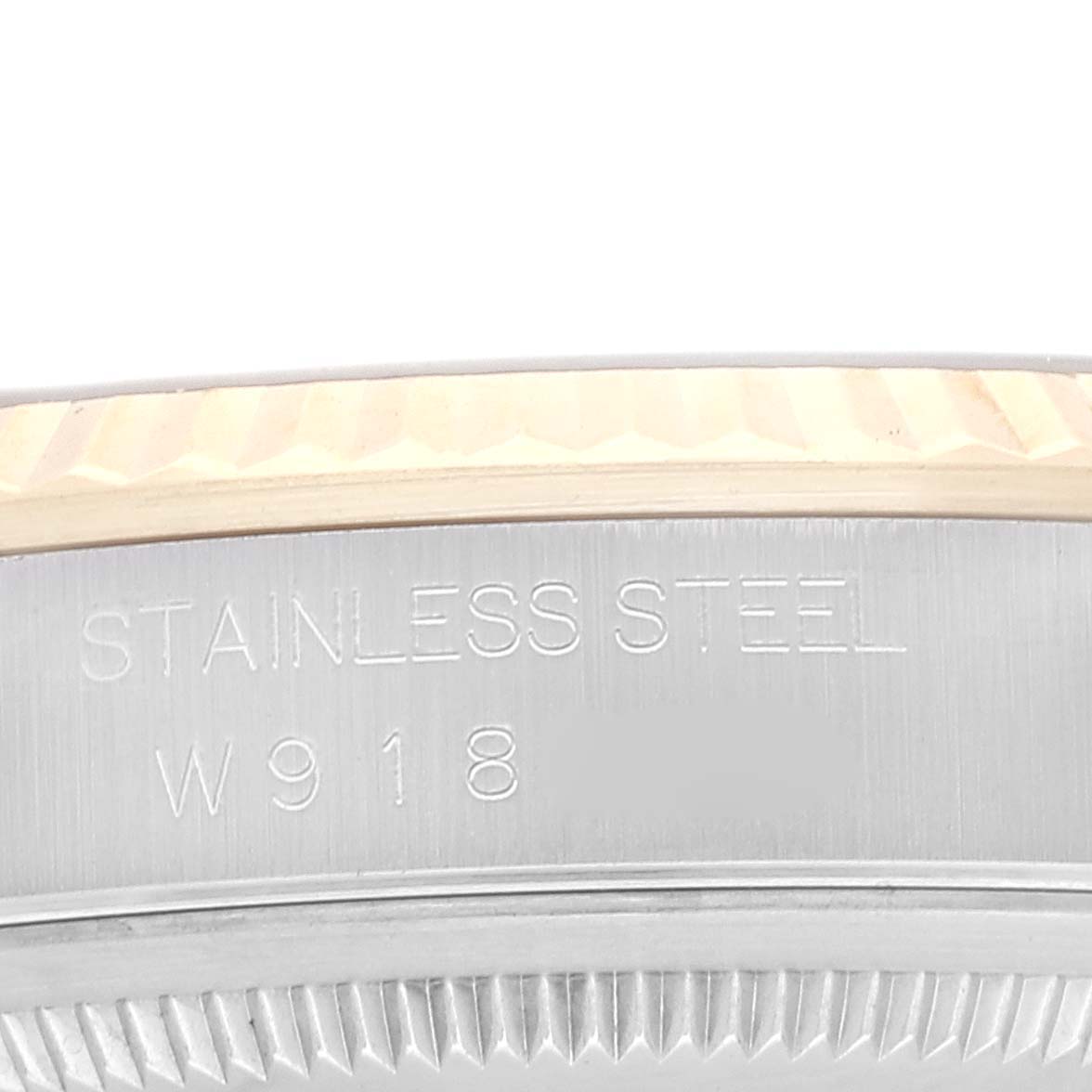 This image shows a close-up angle of the bezel and case side of a Rolex Datejust 16233 Men's Steel and Gold (two tone) Grey Dial 16233 Men's Steel and Gold (two tone) Grey Dial watch, highlighting the "Stainless Steel" engraving.