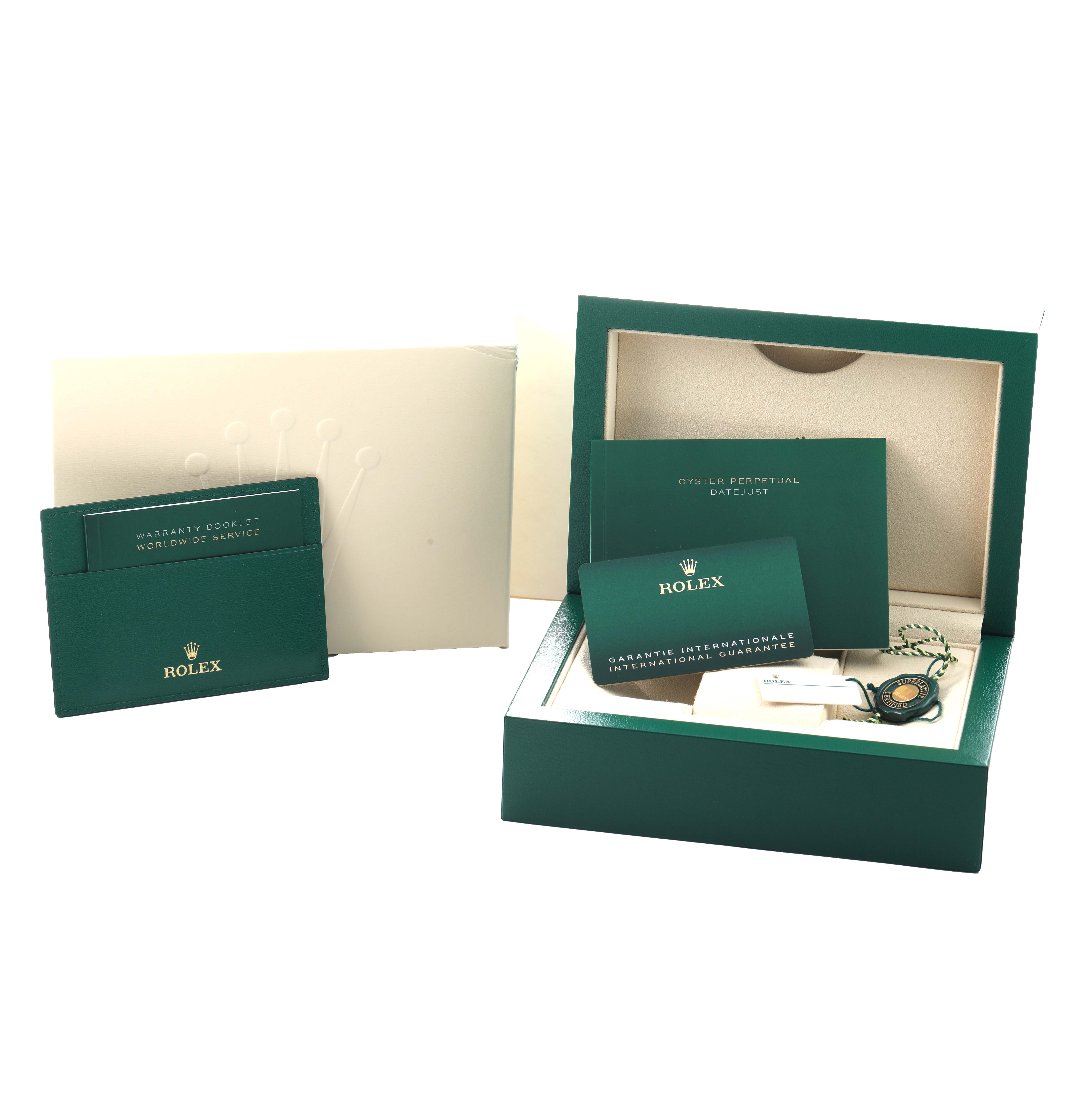 The image shows the Rolex Datejust 126234 Men's Stainless Steel Blue Dial packaging and accessories, including a warranty booklet, guarantee card, and green box.