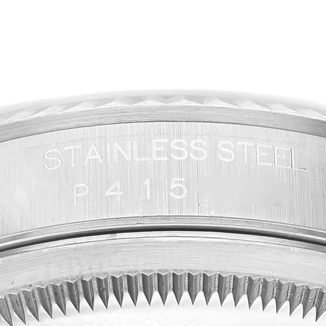 The image shows a close-up of the side of a Rolex Datejust 16234 Men's Stainless Steel White Dial 16234 Men's Stainless Steel White Dial watch, highlighting the stainless steel engraving and part of the bezel.