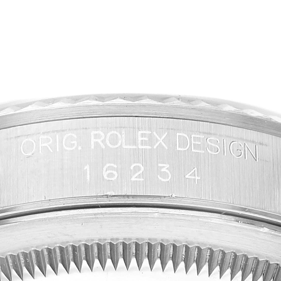 This image shows a close-up of the side engraving and bezel of a Rolex Datejust 16234 Men's Stainless Steel White Dial 16234 Men's Stainless Steel White Dial watch.