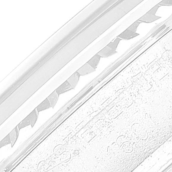 This image shows a close-up of the fluted bezel of a Rolex Datejust 1601 Men
s Stainless Steel Silver Dial 1601 Men
s Stainless Steel Silver Dial watch.