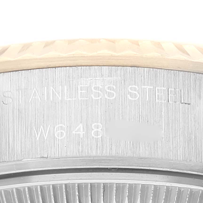 This close-up image shows the engraved stainless steel case back and part of the bezel of the Rolex Datejust 69173 Women's Steel and Gold (two tone) Champagne Dial 69173 Women's Steel and Gold (two tone) Champagne Dial watch.