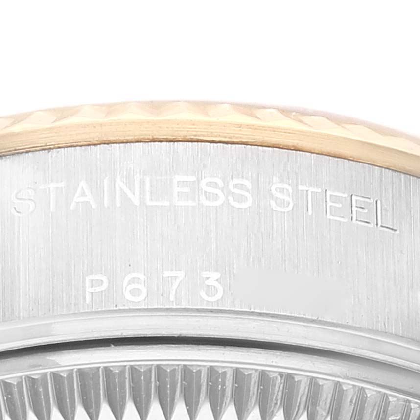 This is a close-up angle of the stainless steel caseback and serial number of a Rolex Datejust 79173 Women's Steel and Gold (two tone) Champagne Dial 79173 Women's Steel and Gold (two tone) Champagne Dial watch.