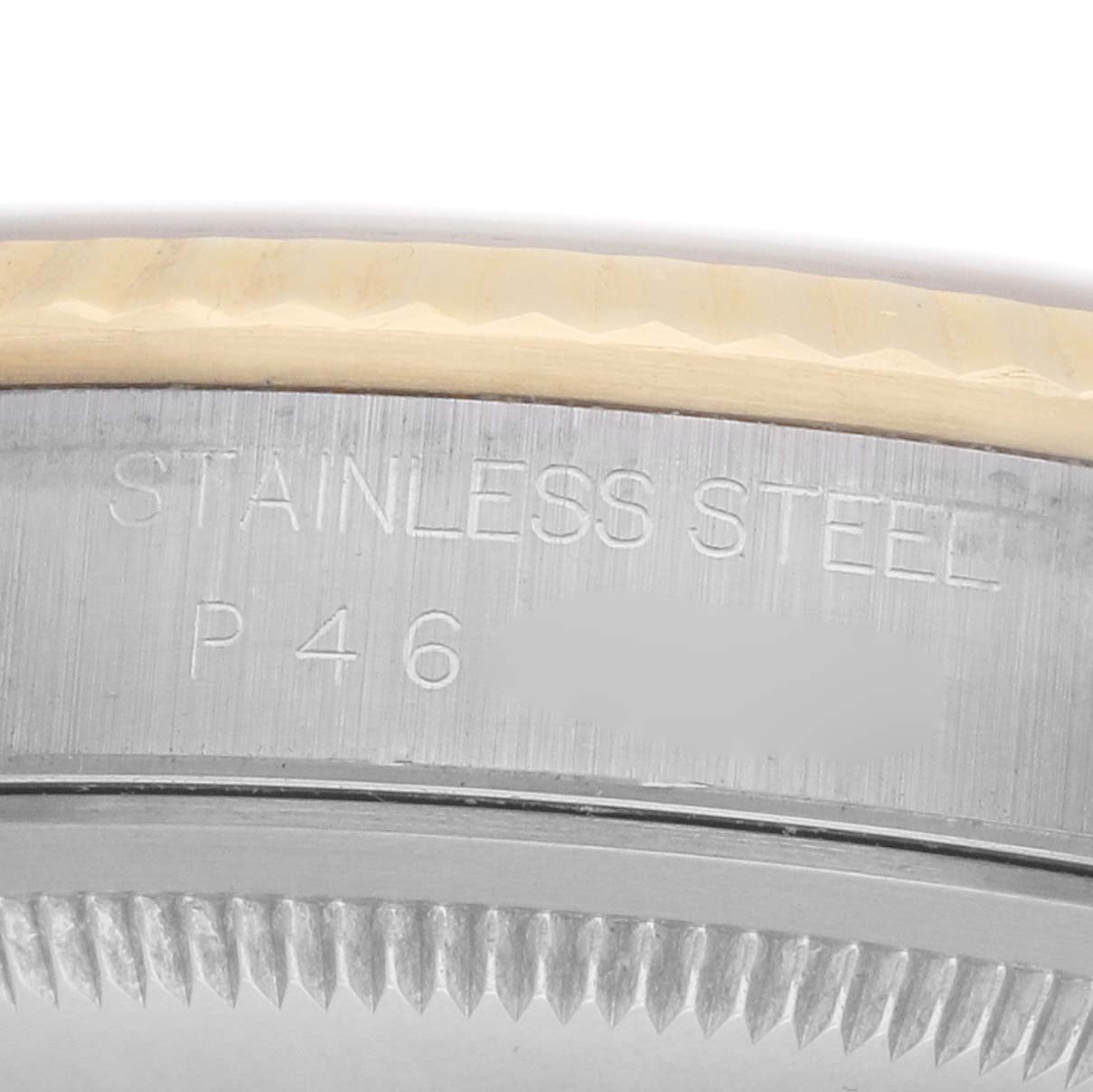 The image shows a close-up of the engraved side of the stainless steel case of a Rolex Datejust 16233 Men's Stainless Steel Champagne Dial.