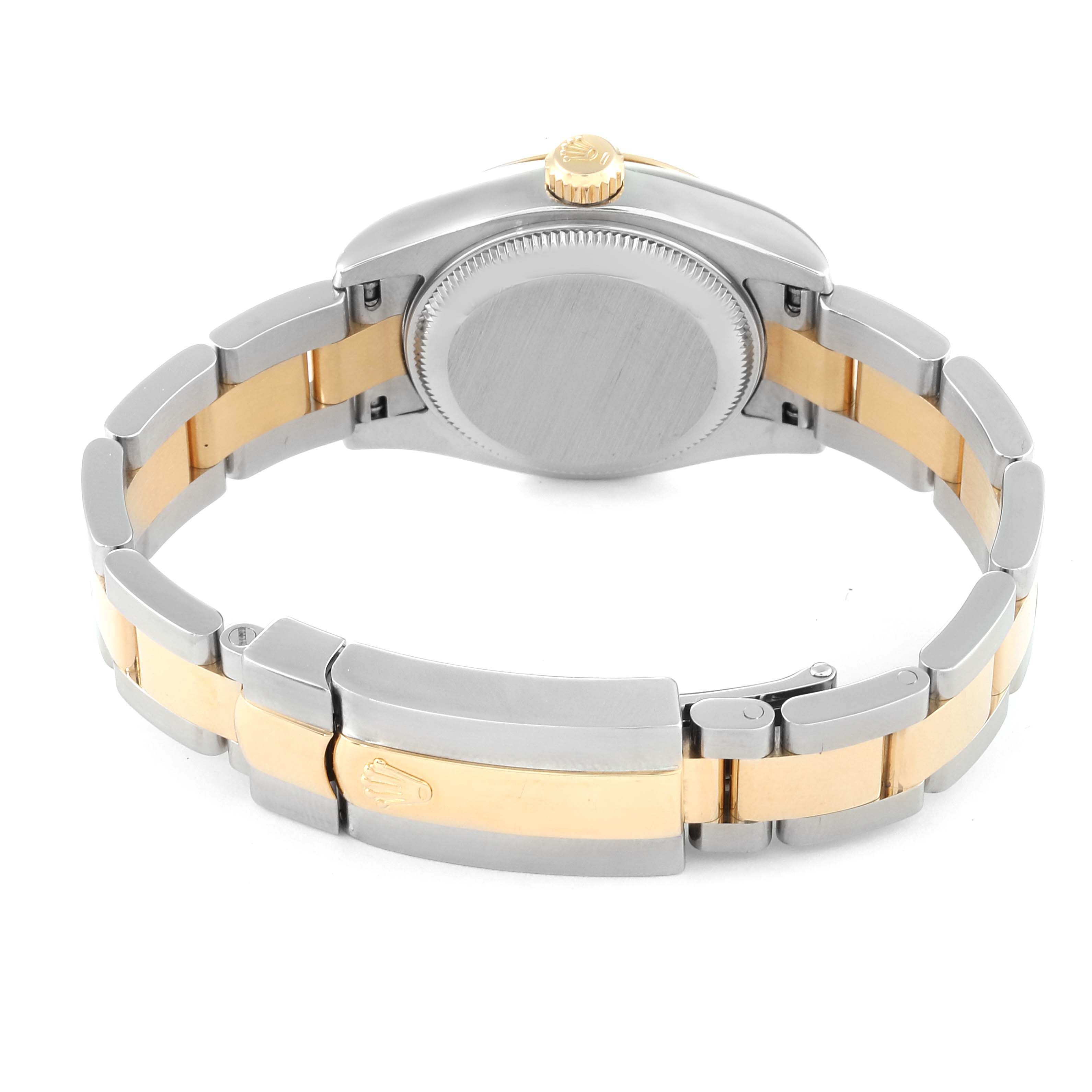 The image shows the back of a Rolex Datejust 179173 Women's Steel and Gold (two tone) Beige Dial 179173 Women's Steel and Gold (two tone) Beige Dial watch, highlighting its silver and gold bracelet and closed clasp.