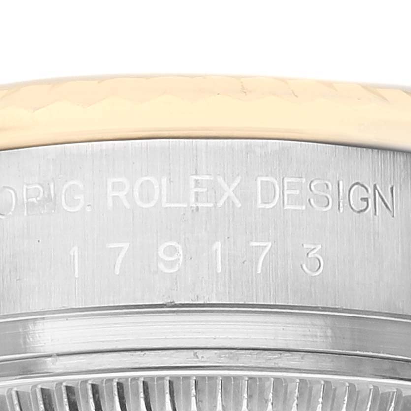 Close-up angle of the model number engraving on the metal case of the Rolex Datejust 179173 Women's Steel and Gold (two tone) Beige Dial 179173 Women's Steel and Gold (two tone) Beige Dial watch.