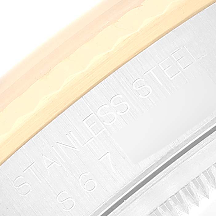 The image shows a close-up of the case back edge of a Rolex Datejust 16233 Men's Steel and Gold (two tone) Beige Dial 16233 Men's Steel and Gold (two tone) Beige Dial, highlighting "STAINLESS STEEL" engraving.