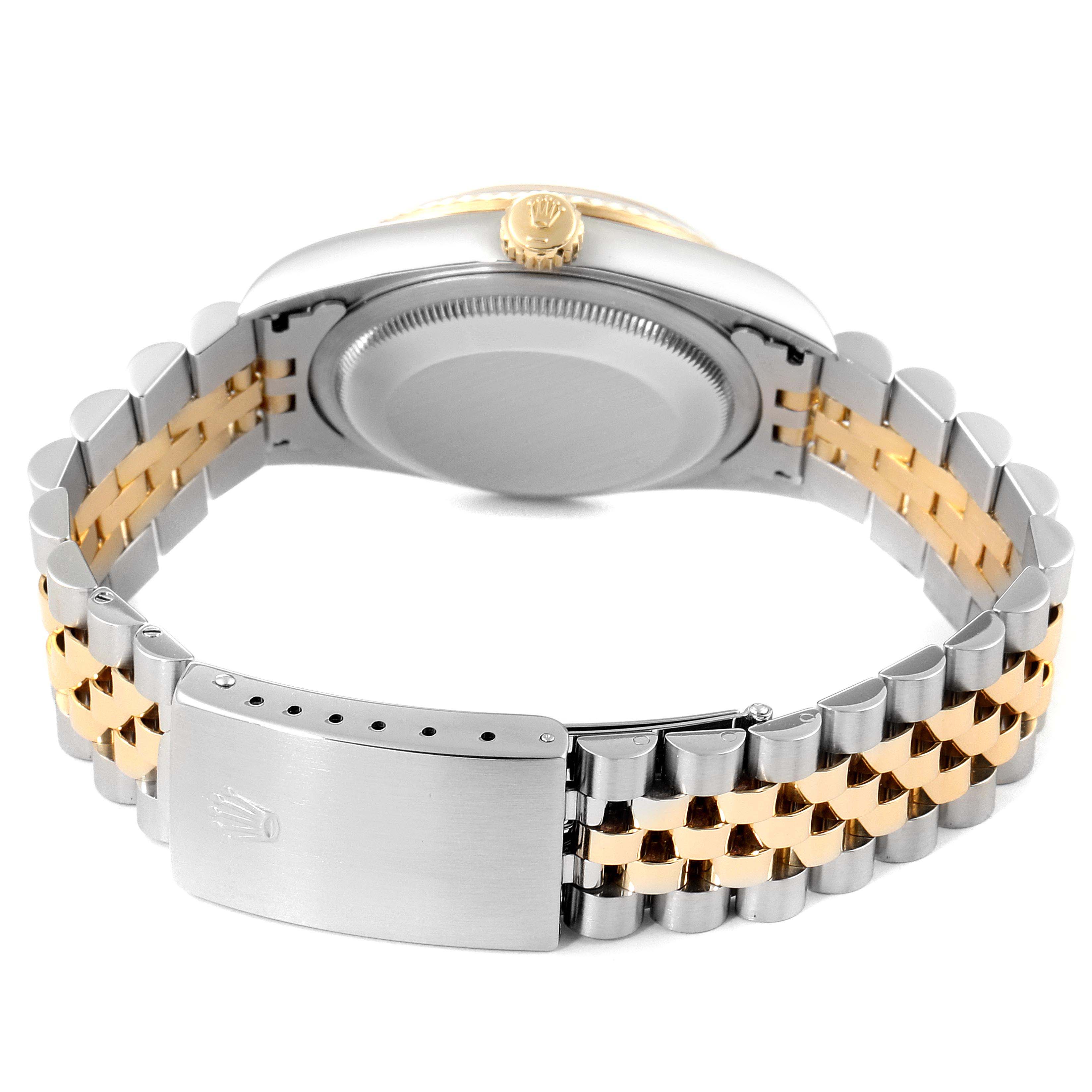 The image shows the back and side view of a Rolex Datejust 16233 Men
s Stainless Steel Grey Dial 16233 Men
s Stainless Steel Grey Dial watch, highlighting its case back, crown, and two-tone bracelet with clasp.