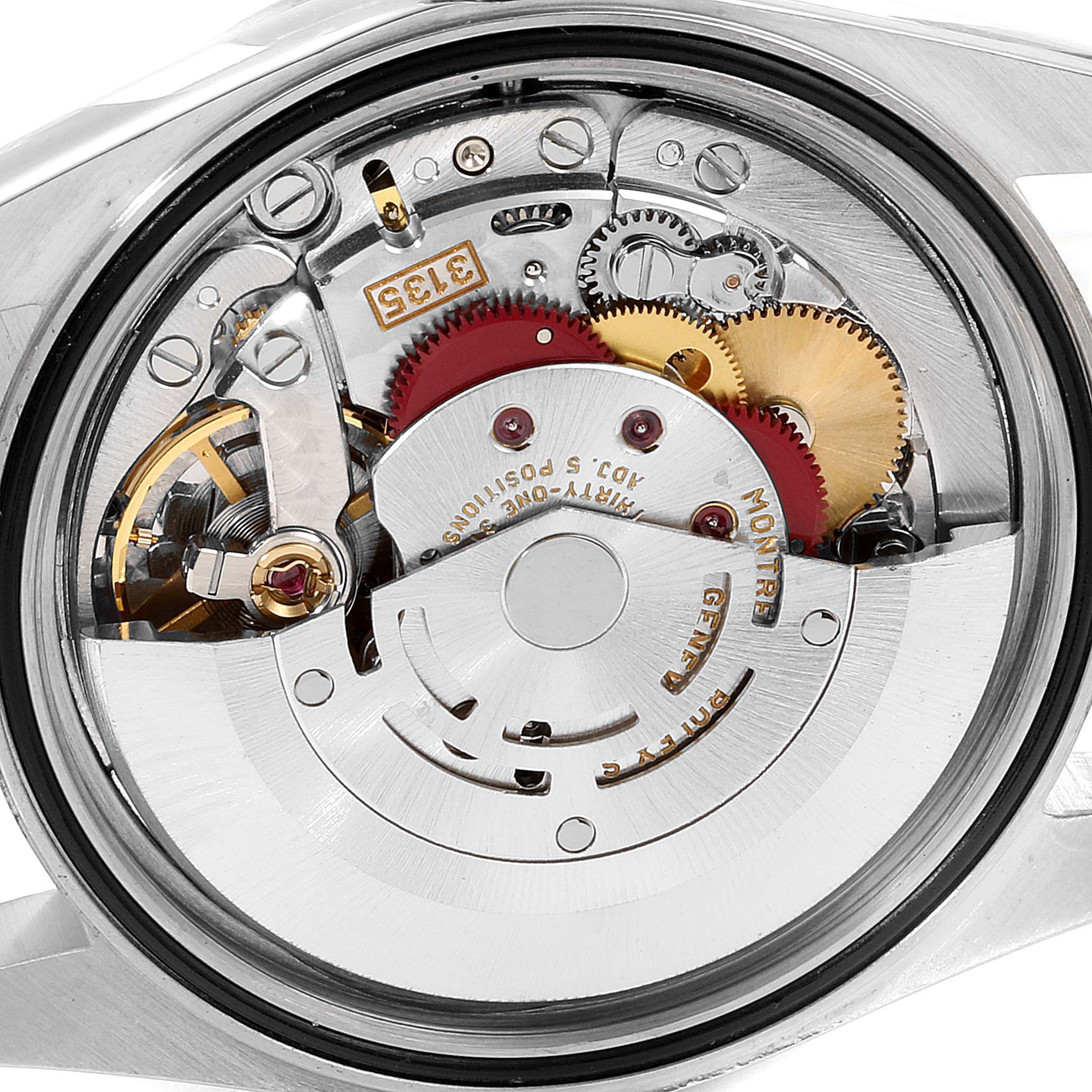 This image shows a close-up of the movement and internal gears of a Rolex Datejust 16233 Men
s Stainless Steel Grey Dial 16233 Men
s Stainless Steel Grey Dial watch from the back.