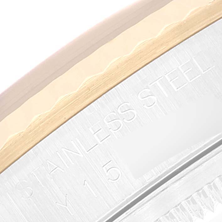 This close-up image shows the stainless steel back and part of the bezel of a Rolex Datejust 16233 Men's Steel and Gold (two tone) Blue Dial 16233 Men's Steel and Gold (two tone) Blue Dial watch.