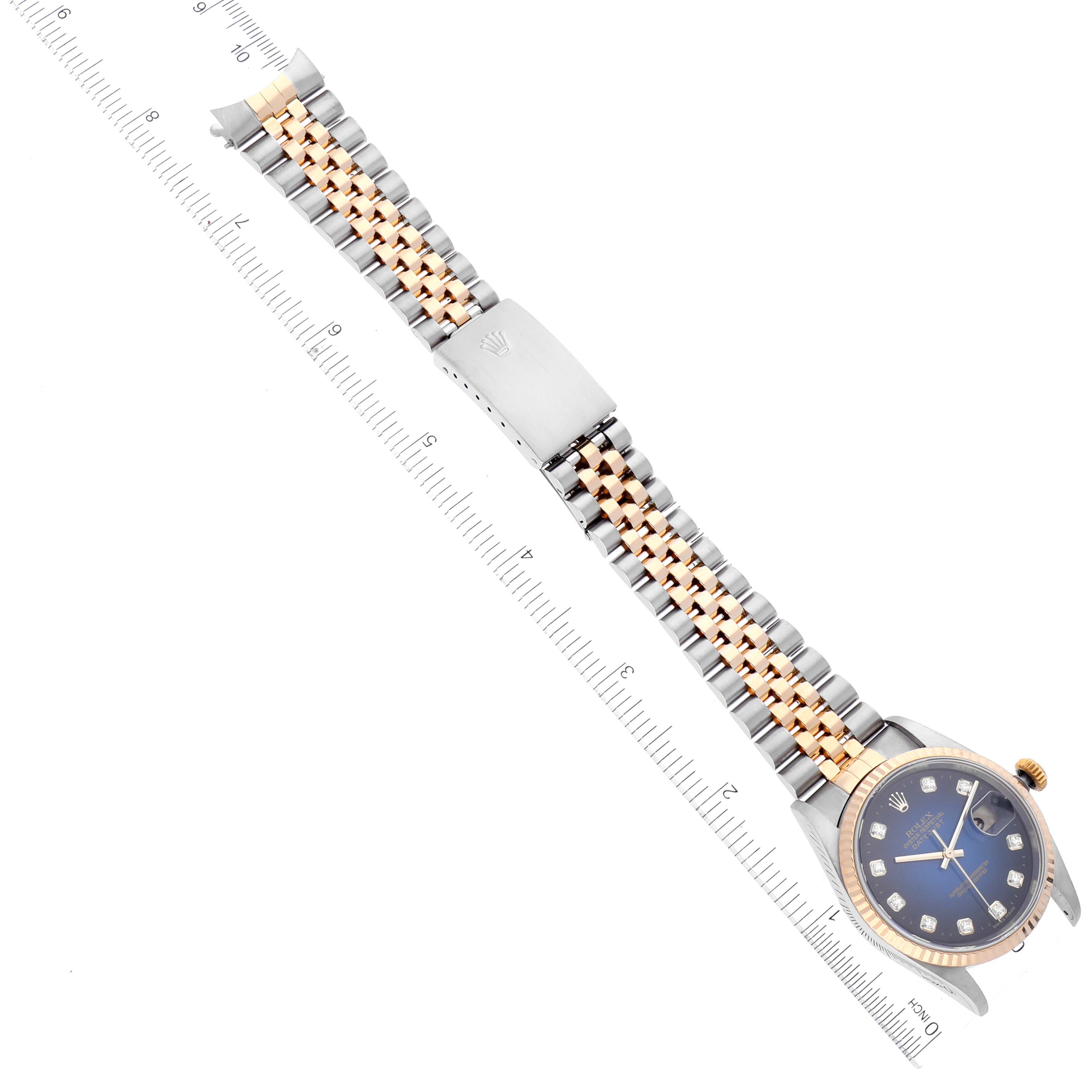 The Rolex Datejust 16233 Men's Steel and Gold (two tone) Blue Dial 16233 Men's Steel and Gold (two tone) Blue Dial watch is shown at an oblique angle, featuring the full bracelet with a dual-tone design and a blue dial.