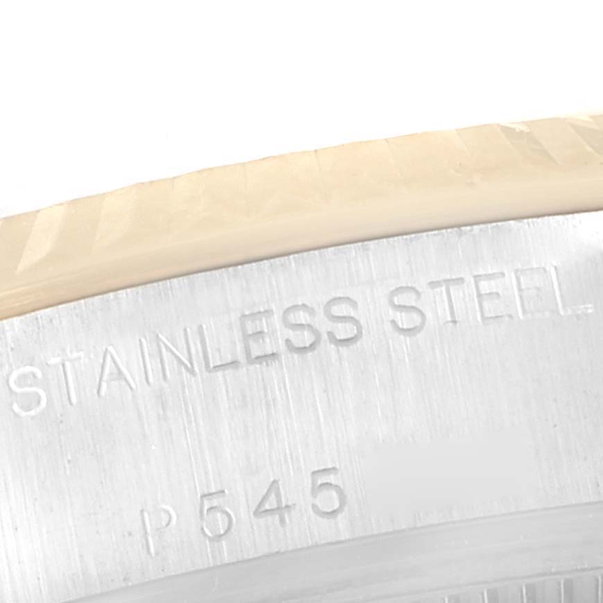 This shows the close-up view of the stainless steel casing of a Rolex Datejust 79173 Women's Steel and Gold (two tone) White Dial 79173 Women's Steel and Gold (two tone) White Dial watch with serial markings visible.