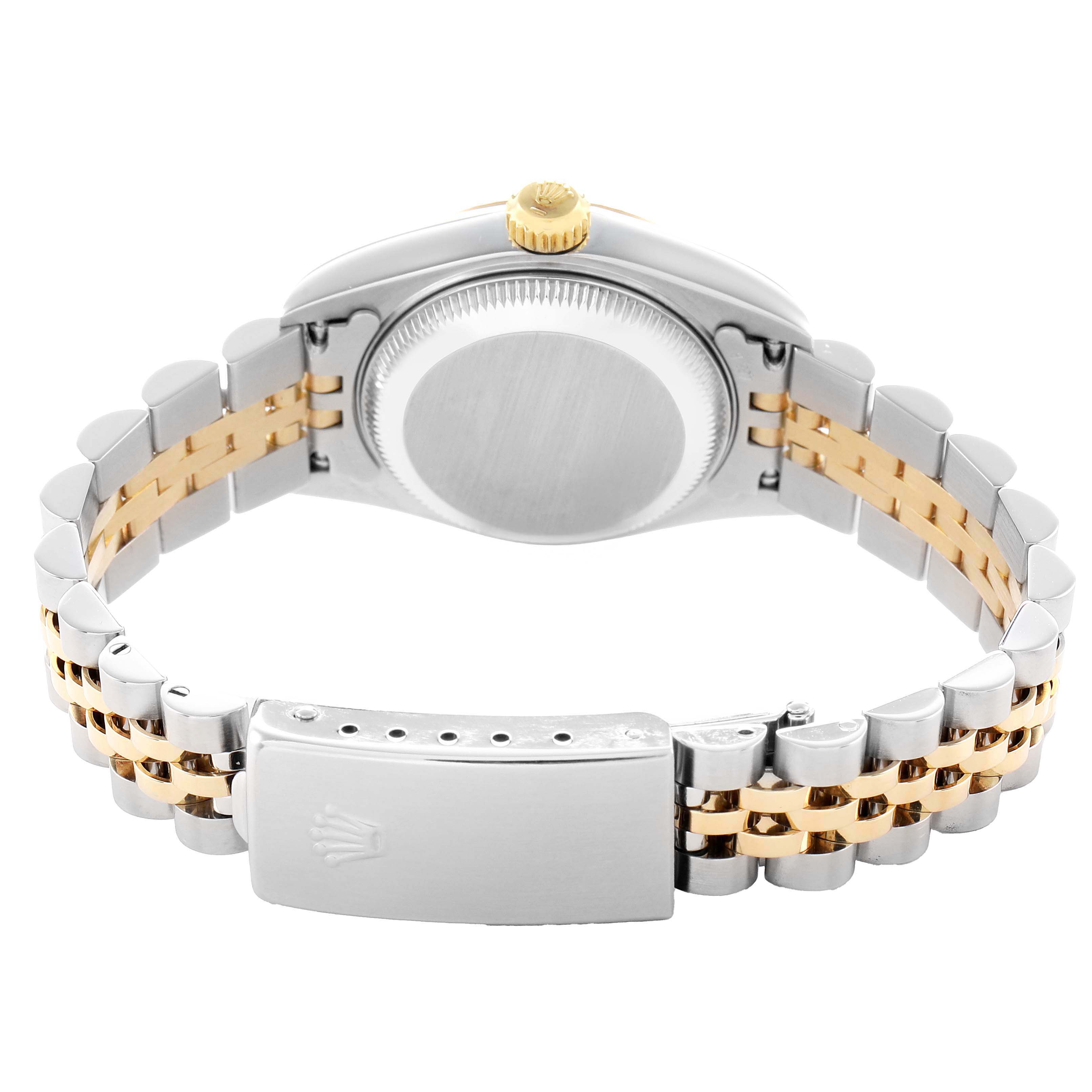 The Rolex Datejust 79173 Women's Steel and Gold (two tone) White Dial is shown from the back, displaying its case, crown, and two-tone bracelet with the clasp.