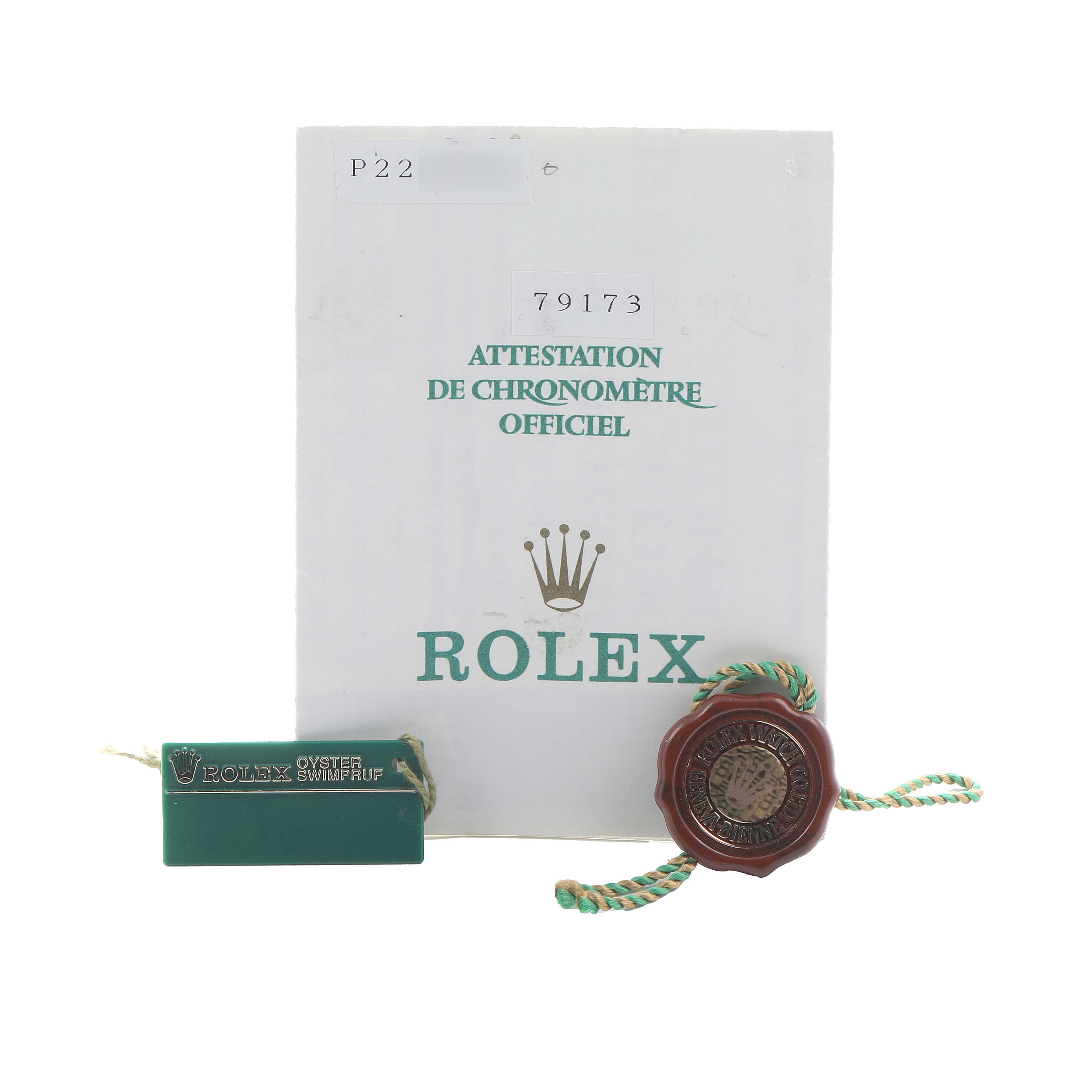 The image shows the warranty and tags for a Rolex Datejust 79173 Women's Steel and Gold (two tone) White Dial, including the certificate and two seals.