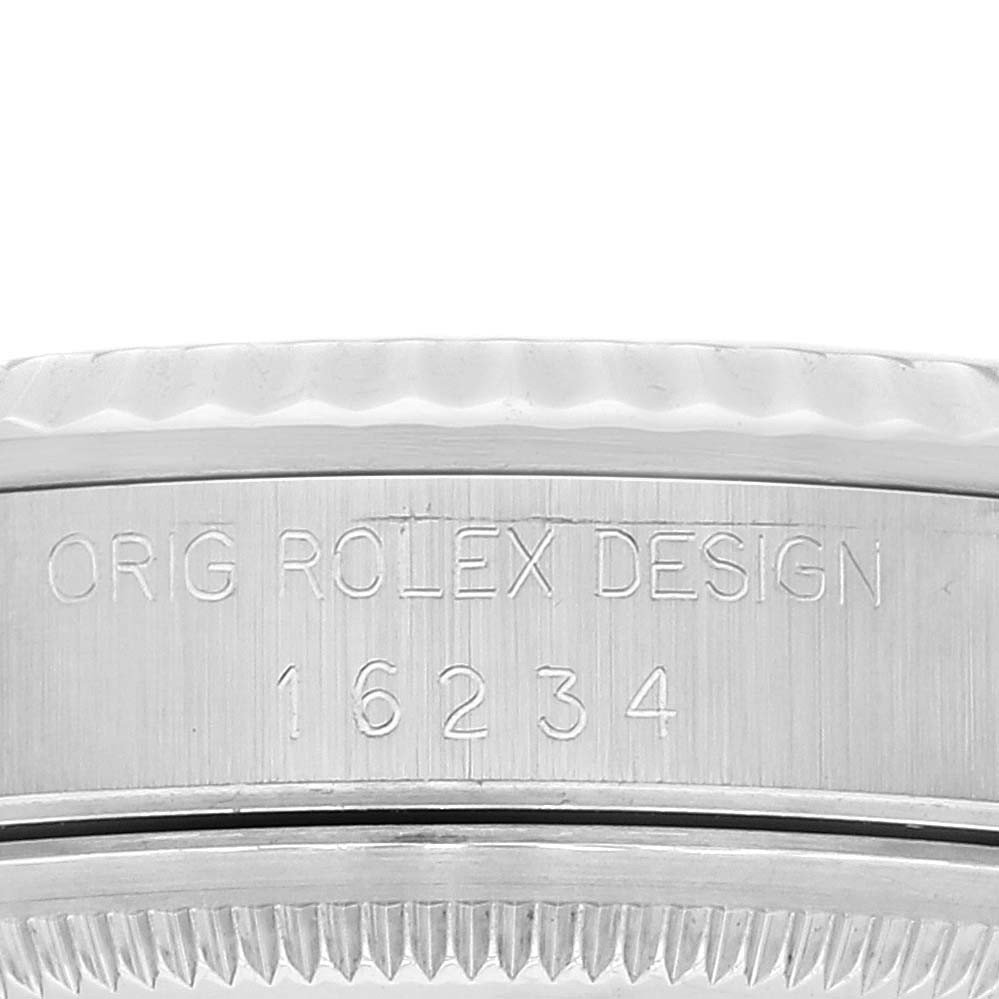 The image shows the serial number engraving on the case side of a Rolex Datejust 16234 Men's Stainless Steel White Dial 16234 Men's Stainless Steel White Dial watch.