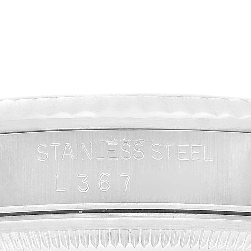 The image shows a close-up of the stainless steel casing and serial number of a Rolex Datejust 16234 Men's Stainless Steel White Dial 16234 Men's Stainless Steel White Dial watch.