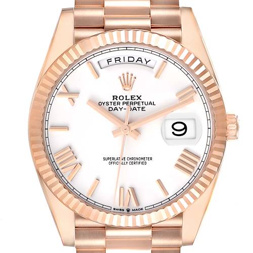The Rolex President model is shown from the front, displaying the face, bezel, and part of the bracelet.