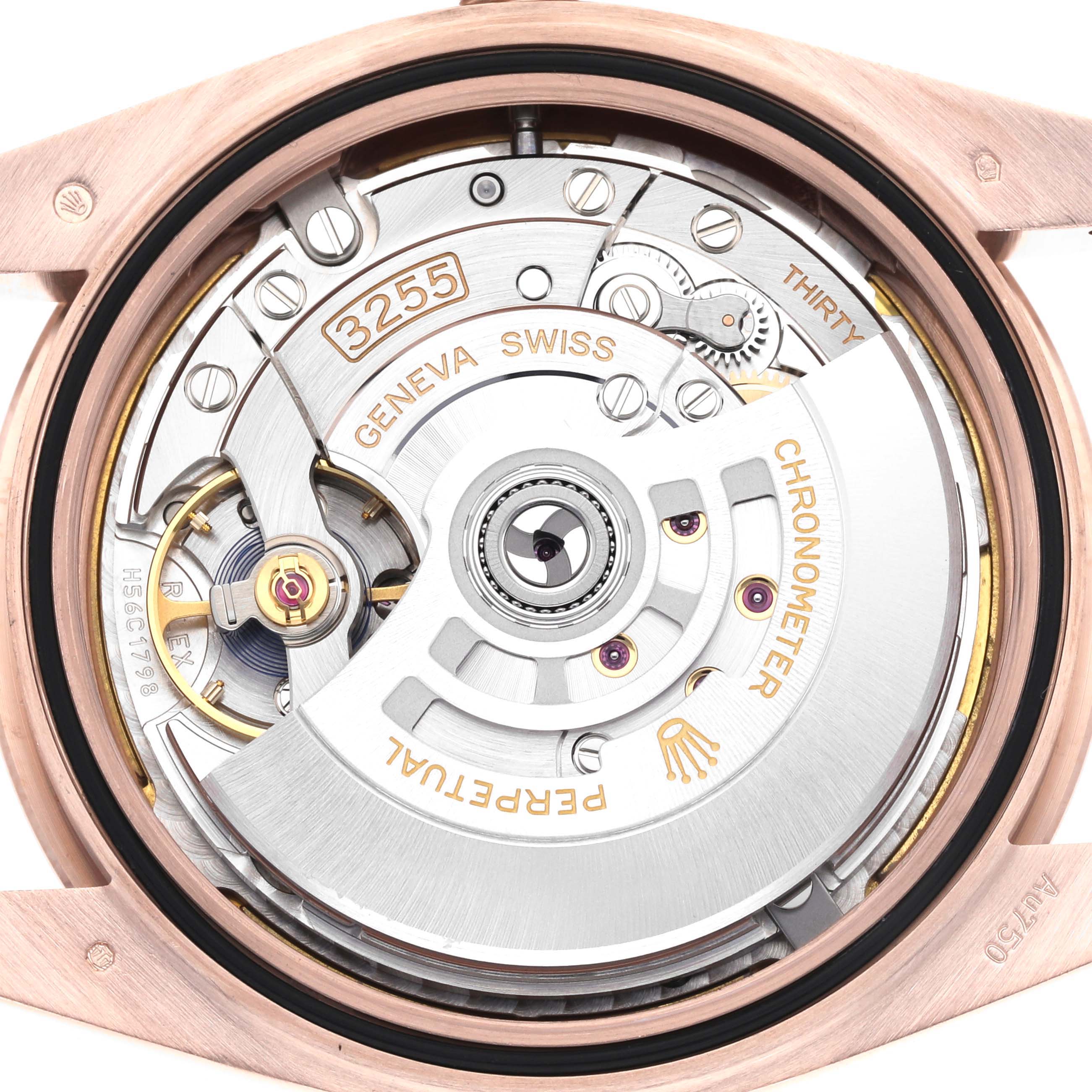 The image shows the back view of the Rolex President 228235 Men's Rose Gold White Dial 228235 Men's Rose Gold White Dial model, highlighting its intricate movement and rotor.