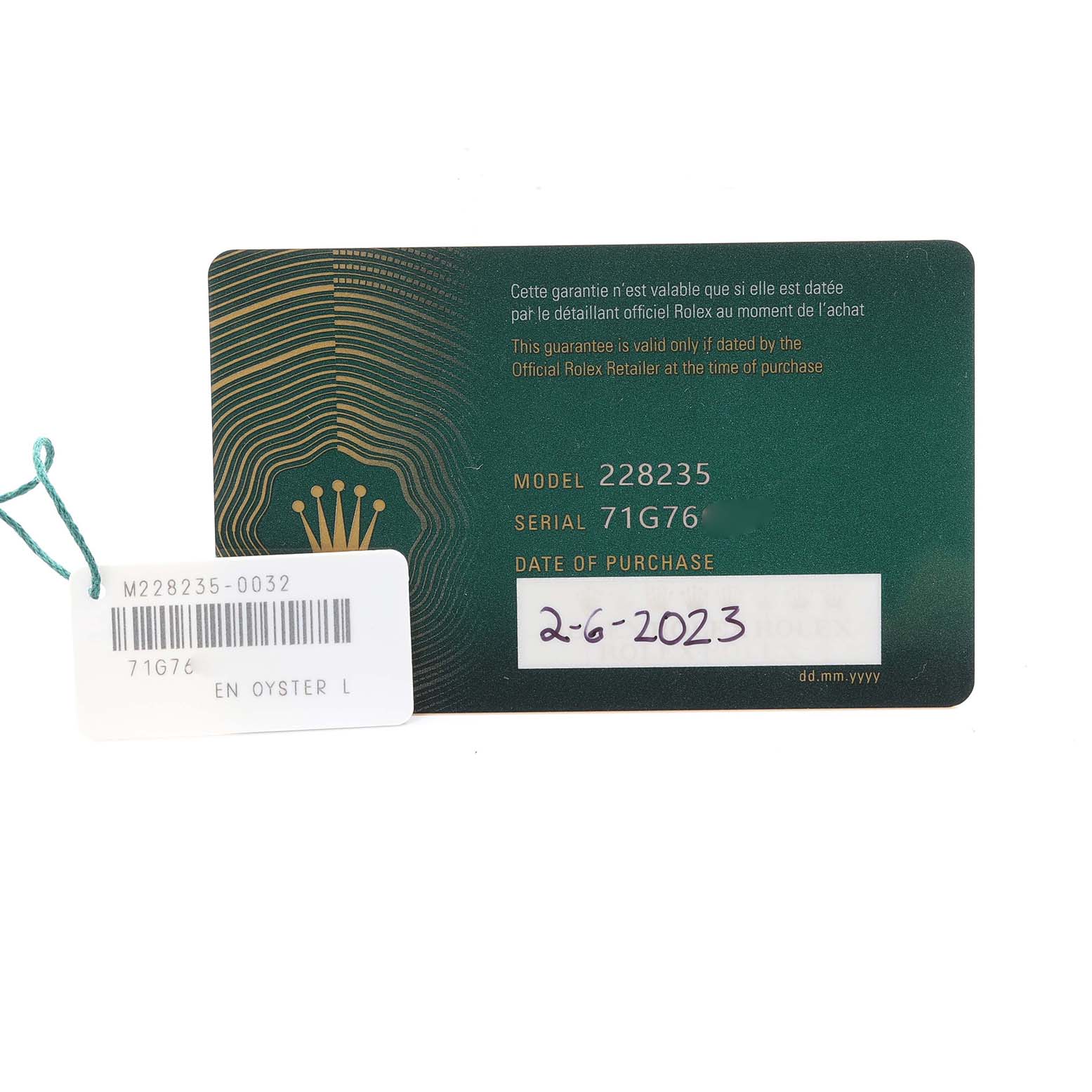 The image shows a Rolex President 228235 Men's Rose Gold White Dial 228235 Men's Rose Gold White Dial model guarantee card and tag with model and serial numbers.