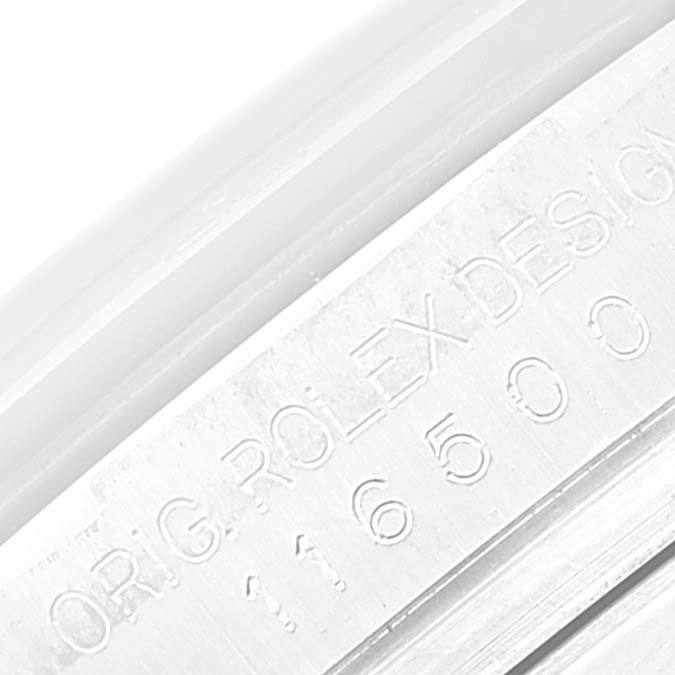 This close-up image features the engraved model number and design details on the inner bezel of a Rolex Daytona 116500 Men's Stainless Steel White Dial 116500 Men's Stainless Steel White Dial watch.