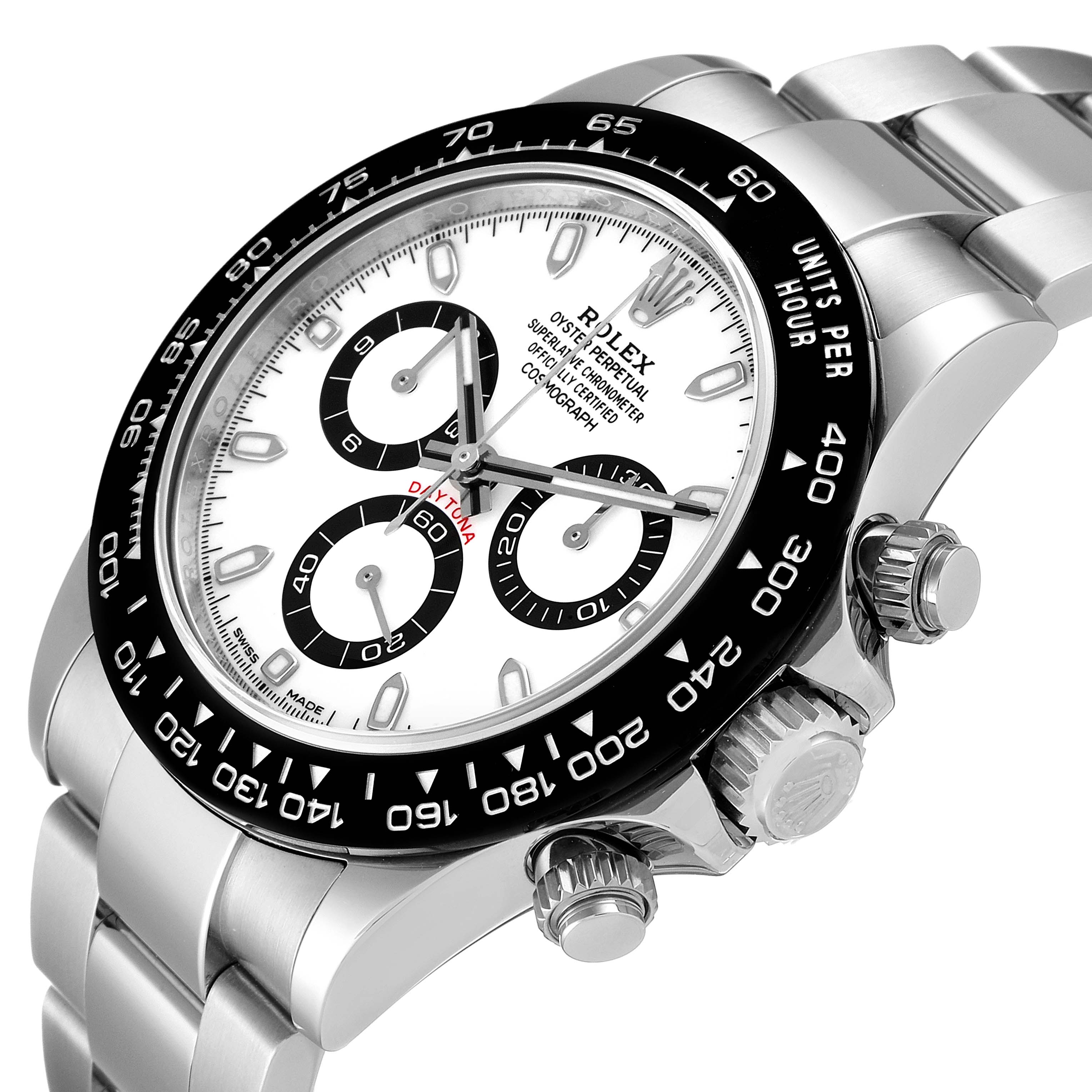 The image shows a Daytona model by Rolex at an angled close-up, highlighting the dial, bezel, pushers, and part of the bracelet.