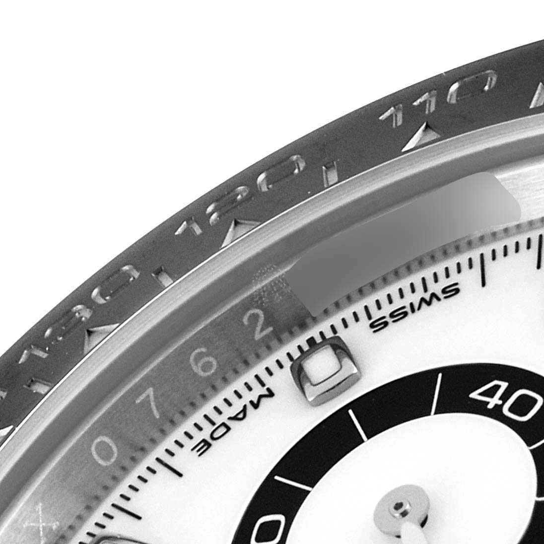 The image shows a close-up of the dial and bezel of a Rolex Daytona 116500 Men's Stainless Steel White Dial 116500 Men's Stainless Steel White Dial watch.