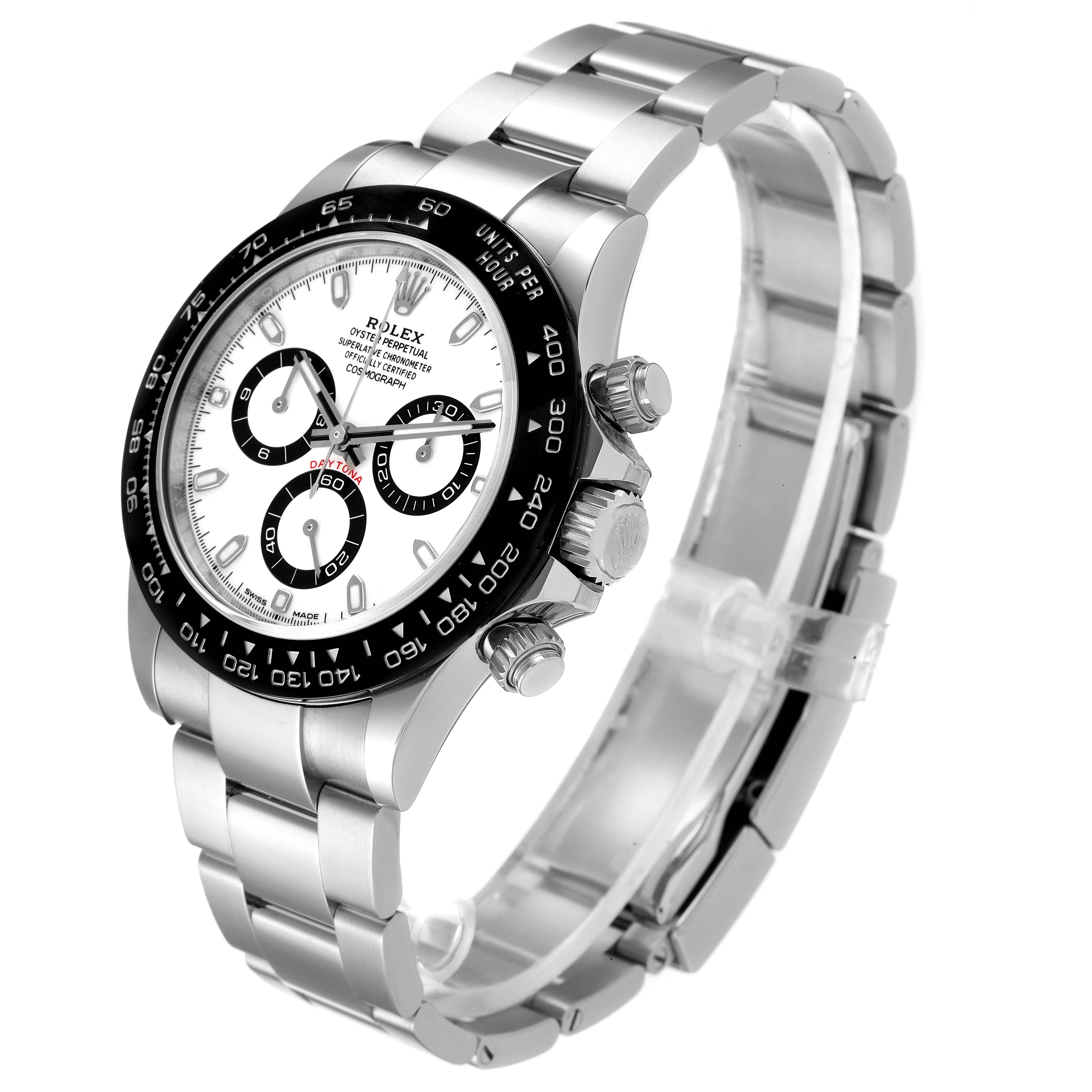 The image shows a Rolex Daytona 116500 Men's Stainless Steel White Dial 116500 Men's Stainless Steel White Dial watch at a 3/4 angle, highlighting the bezel, subdials, crown, and stainless steel bracelet.