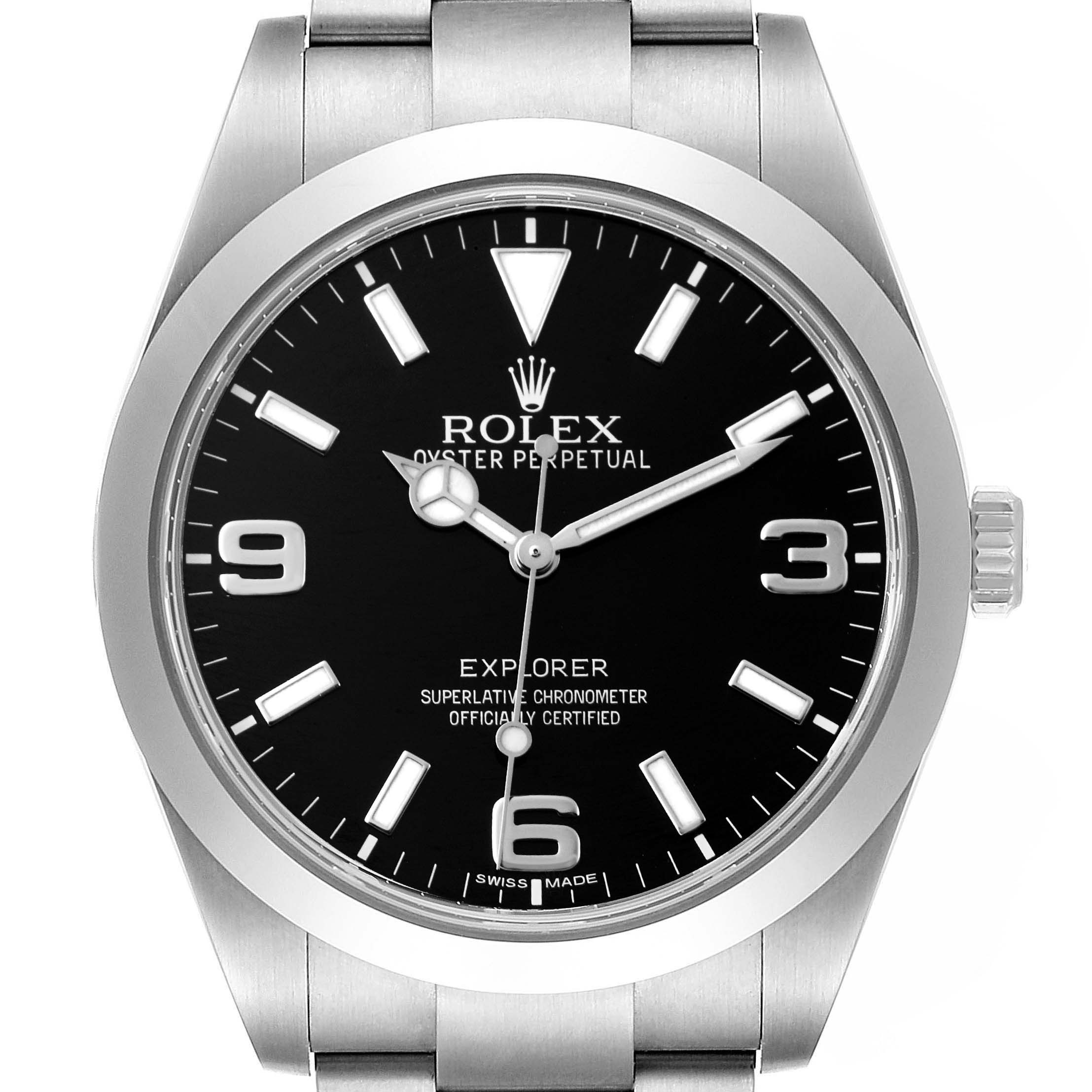 The image shows the face of a Rolex Explorer 214270 Men
s Stainless Steel Black Dial 214270 Men
s Stainless Steel Black Dial model watch, displaying the dial, hands, hour markers, and part of the bracelet.