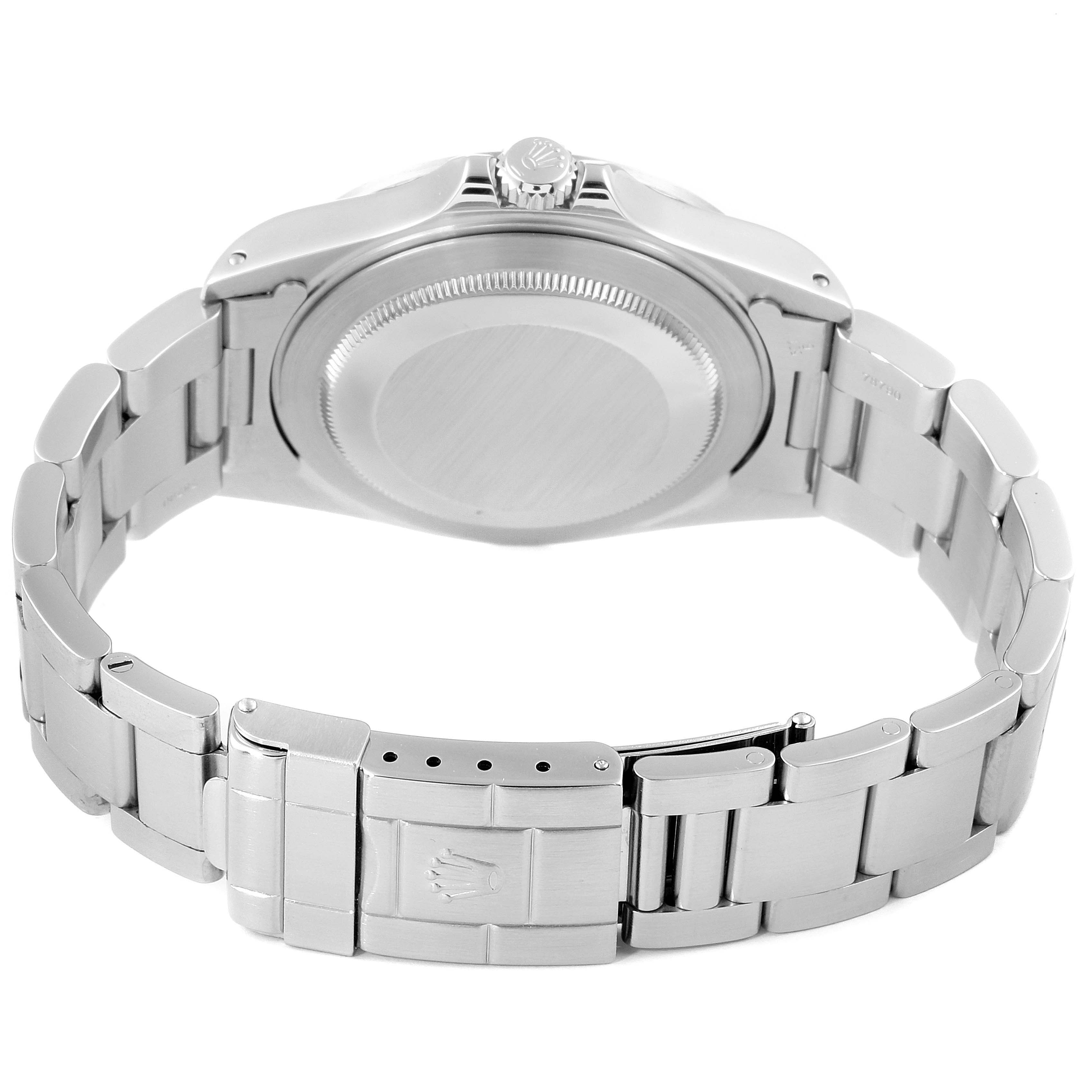 The image shows the back case, crown, and part of the bracelet clasp of a Rolex Explorer 16570 Men
s Stainless Steel Black Dial 16570 Men
s Stainless Steel Black Dial watch.