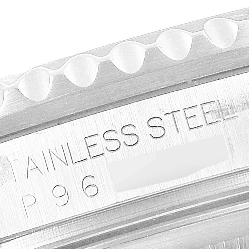The image shows a close-up of the case side engraving on a Rolex GMT-Master 16710 Men
s Stainless Steel Black Dial 16710 Men
s Stainless Steel Black Dial, highlighting the "STAINLESS STEEL" text.