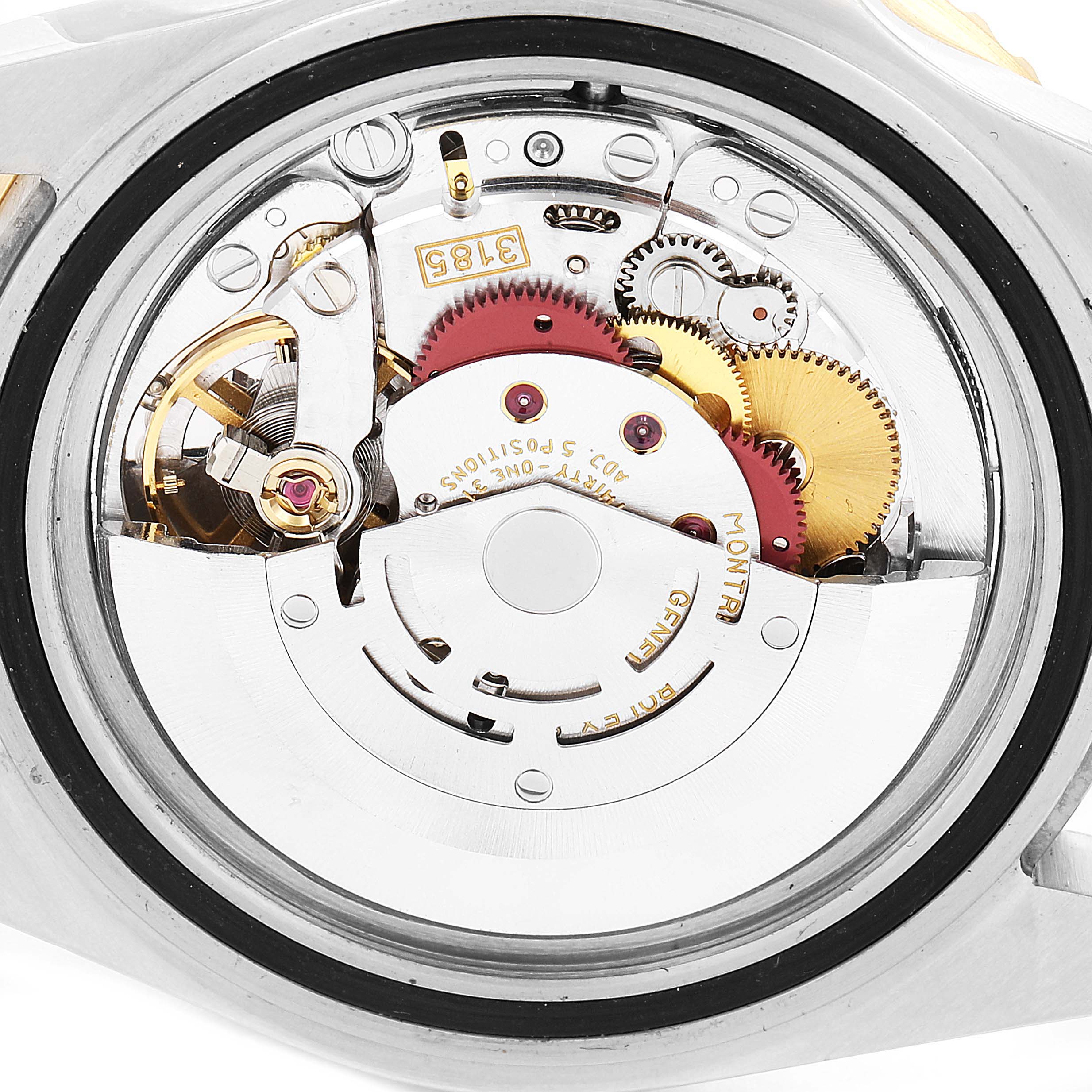 This image shows the internal movement of a Rolex GMT-Master 16713 Men's Steel and Gold (two tone) Black Dial 16713 Men's Steel and Gold (two tone) Black Dial watch, highlighting the gears and mechanisms.