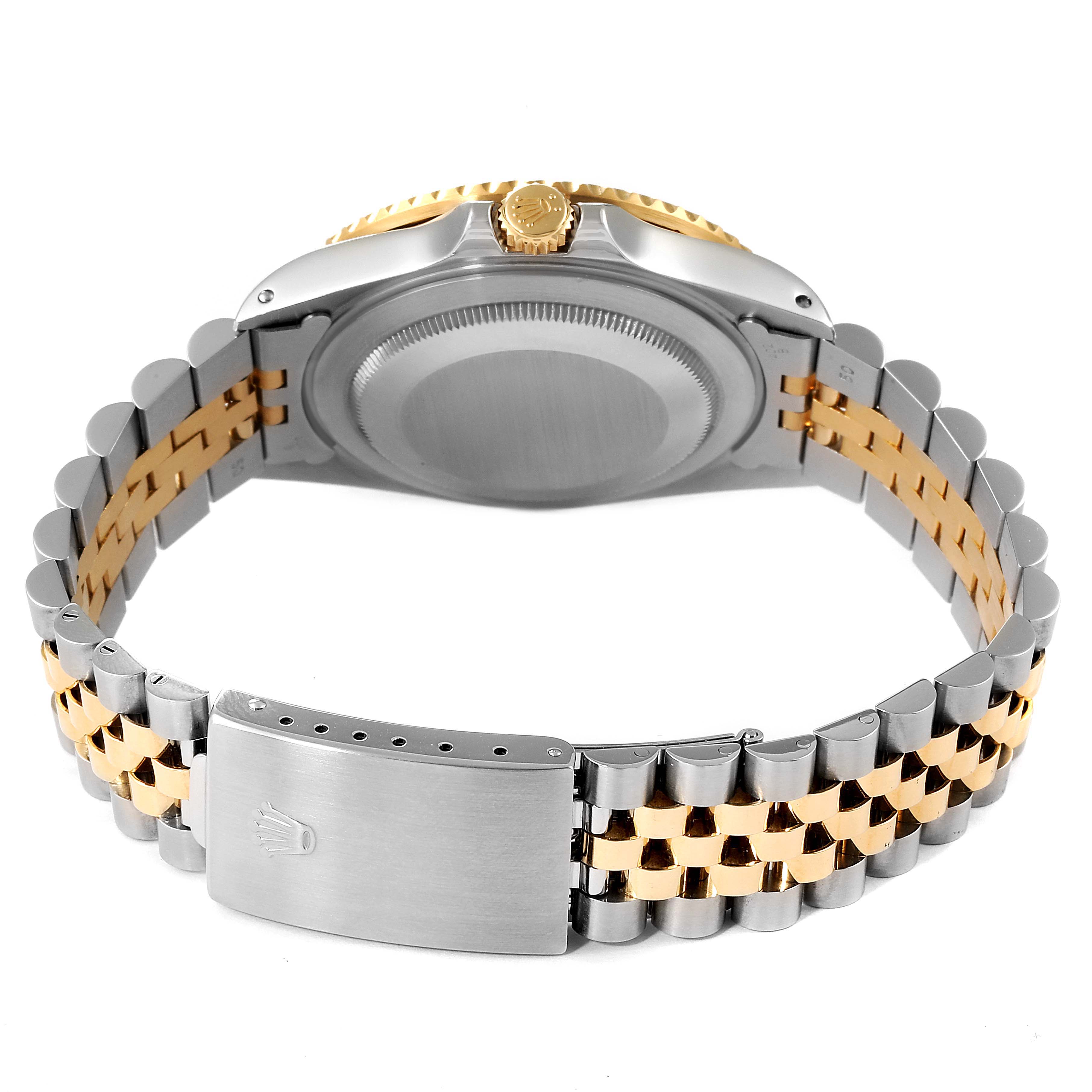 The image shows the back view of a Rolex GMT-Master 16713 Men's Steel and Gold (two tone) Black Dial 16713 Men's Steel and Gold (two tone) Black Dial watch, focusing on the case back, crown, and two-tone bracelet with clasp.