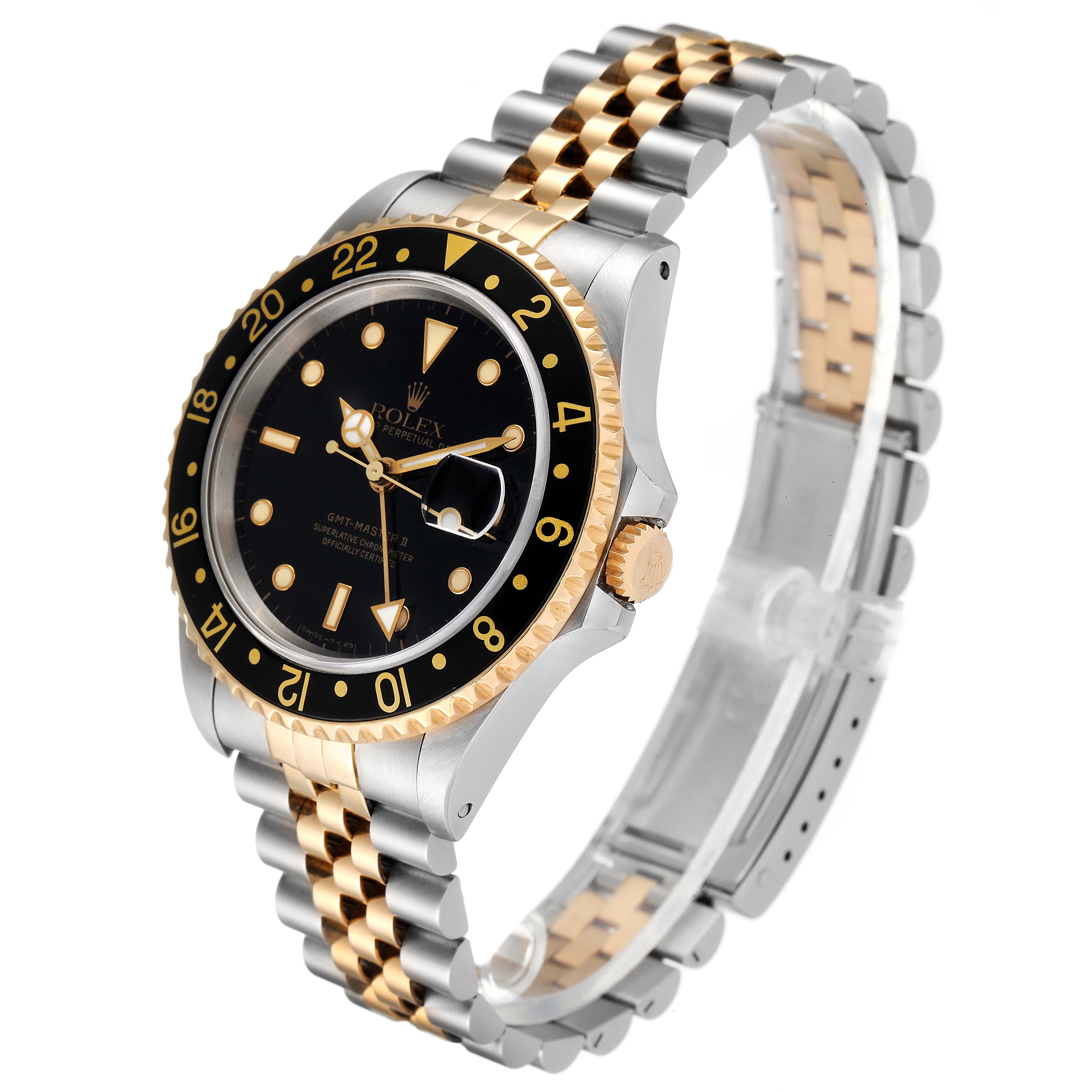 The Rolex GMT-Master 16713 Men's Steel and Gold (two tone) Black Dial 16713 Men's Steel and Gold (two tone) Black Dial watch is shown at an angle from the front-left, displaying its dial, bezel, crown, and two-tone bracelet.