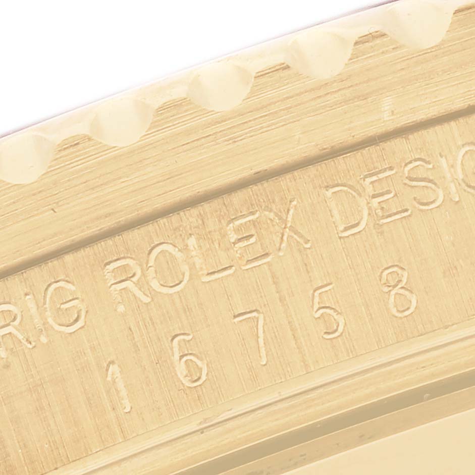 This image shows a close-up of the engraved case side of a Rolex GMT-Master 16758 Men's Yellow Gold Brown Dial 16758 Men's Yellow Gold Brown Dial, highlighting model details.
