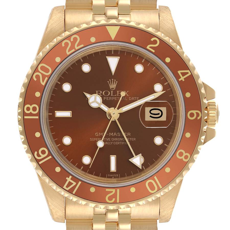 The Rolex GMT-Master is shown from the front, displaying its bezel, dial, hour markers, hands, and date window.