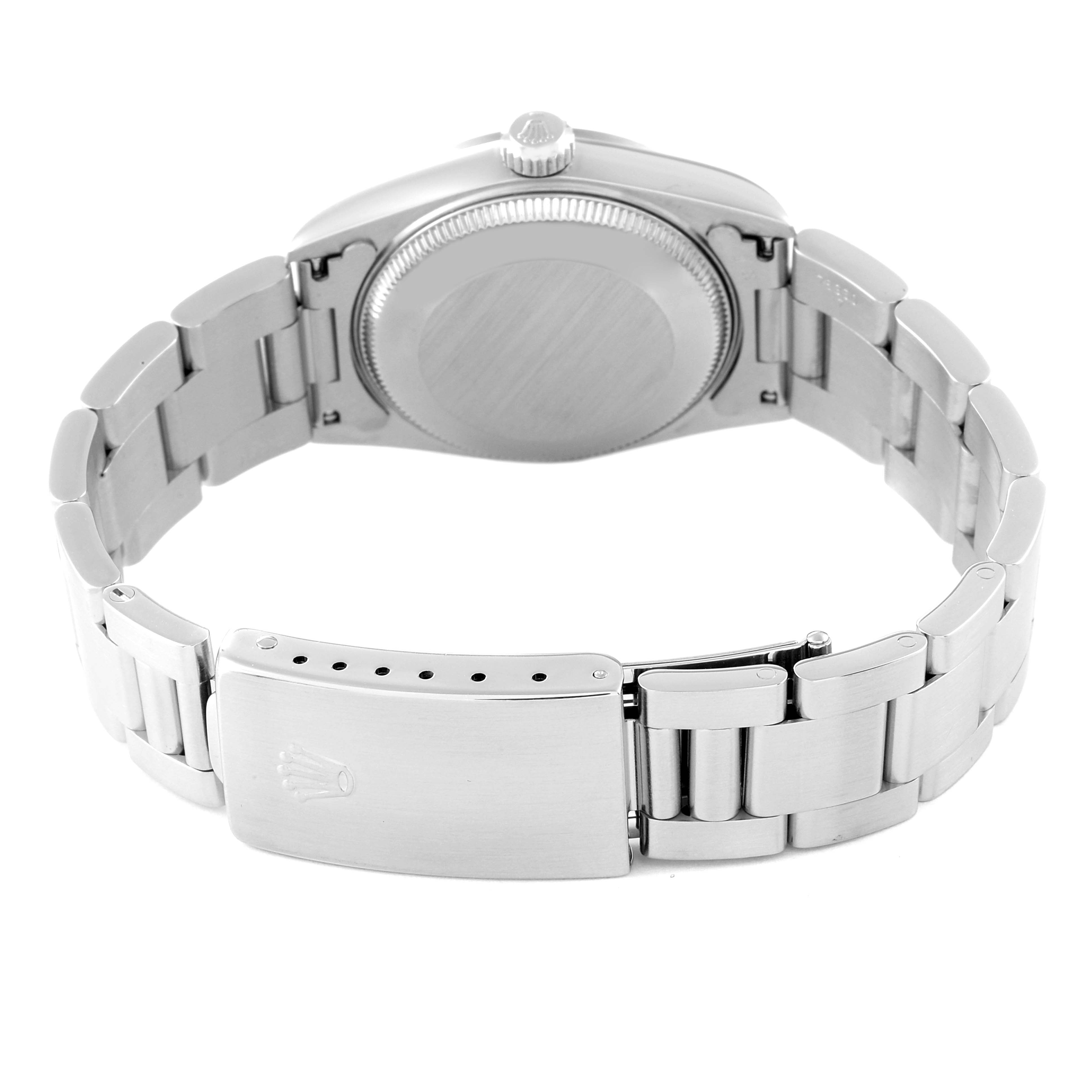 The image shows the back view of a Rolex Datejust 68240 Women's Stainless Steel Mother of Pearl Dial 68240 Women's Stainless Steel Mother of Pearl Dial watch, focusing on the case back and stainless steel bracelet with the clasp.