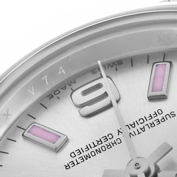 The image shows a close-up of the dial of a Rolex Oyster Perpetual 176200 Women's Stainless Steel Silver Dial, highlighting the 9 o'clock marker and partial text details.