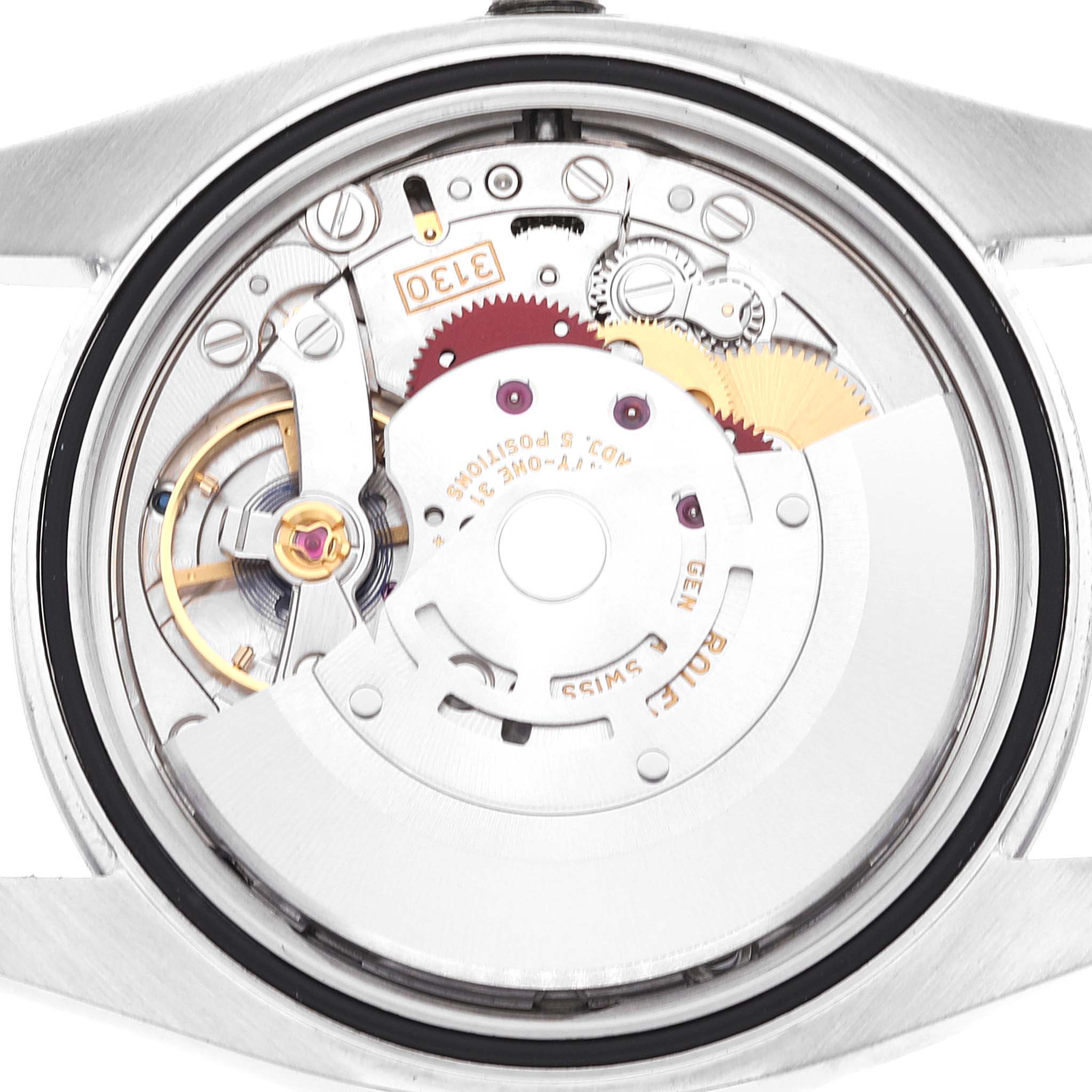 This image shows the back view of a Rolex Oyster Perpetual 116000 Men's Stainless Steel Silver Dial 116000 Men's Stainless Steel Silver Dial watch, revealing the intricate components of its movement mechanism.