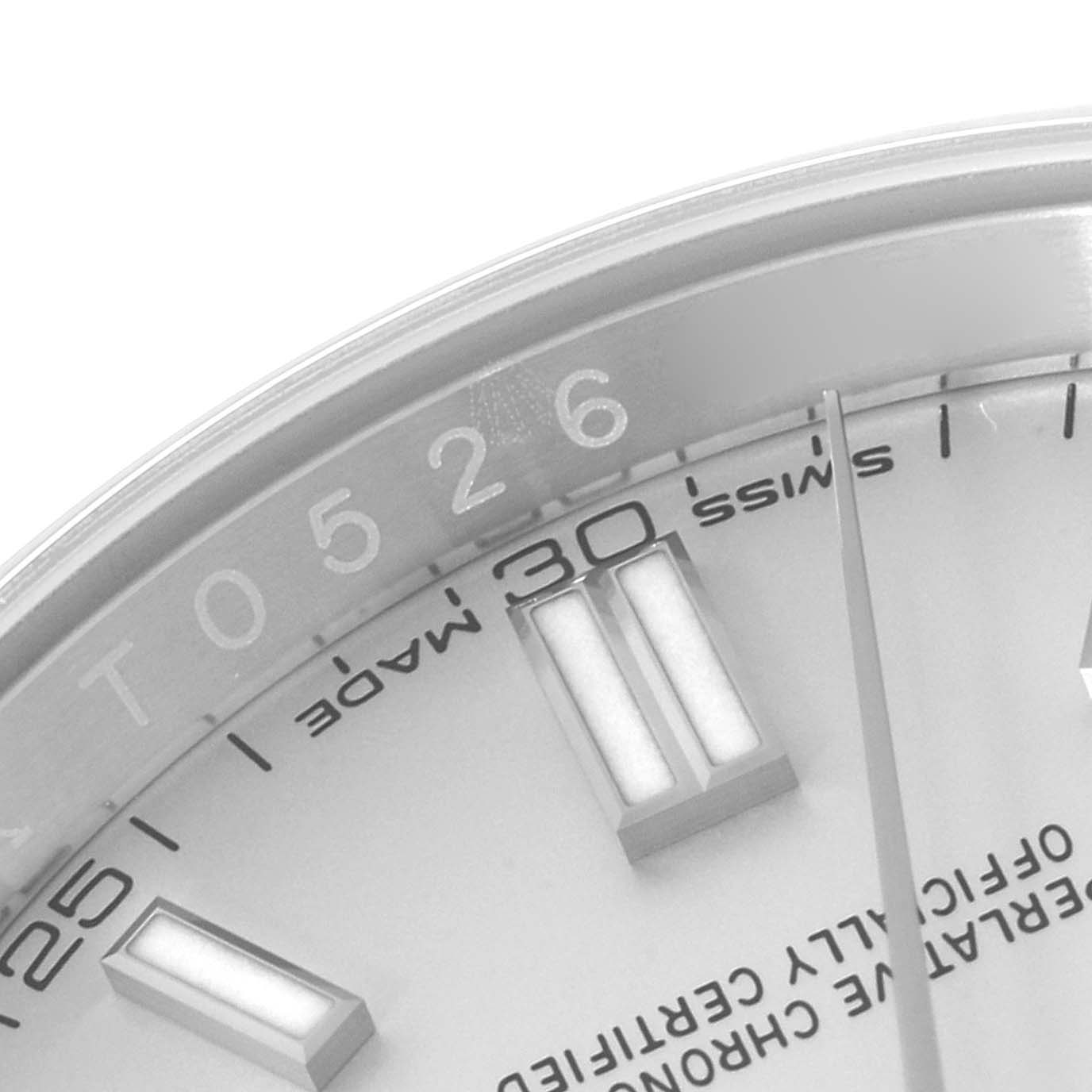 This close-up image shows the upper right portion of the dial of a Rolex Oyster Perpetual 116000 Men's Stainless Steel Silver Dial 116000 Men's Stainless Steel Silver Dial watch, highlighting the minute markers and indices.
