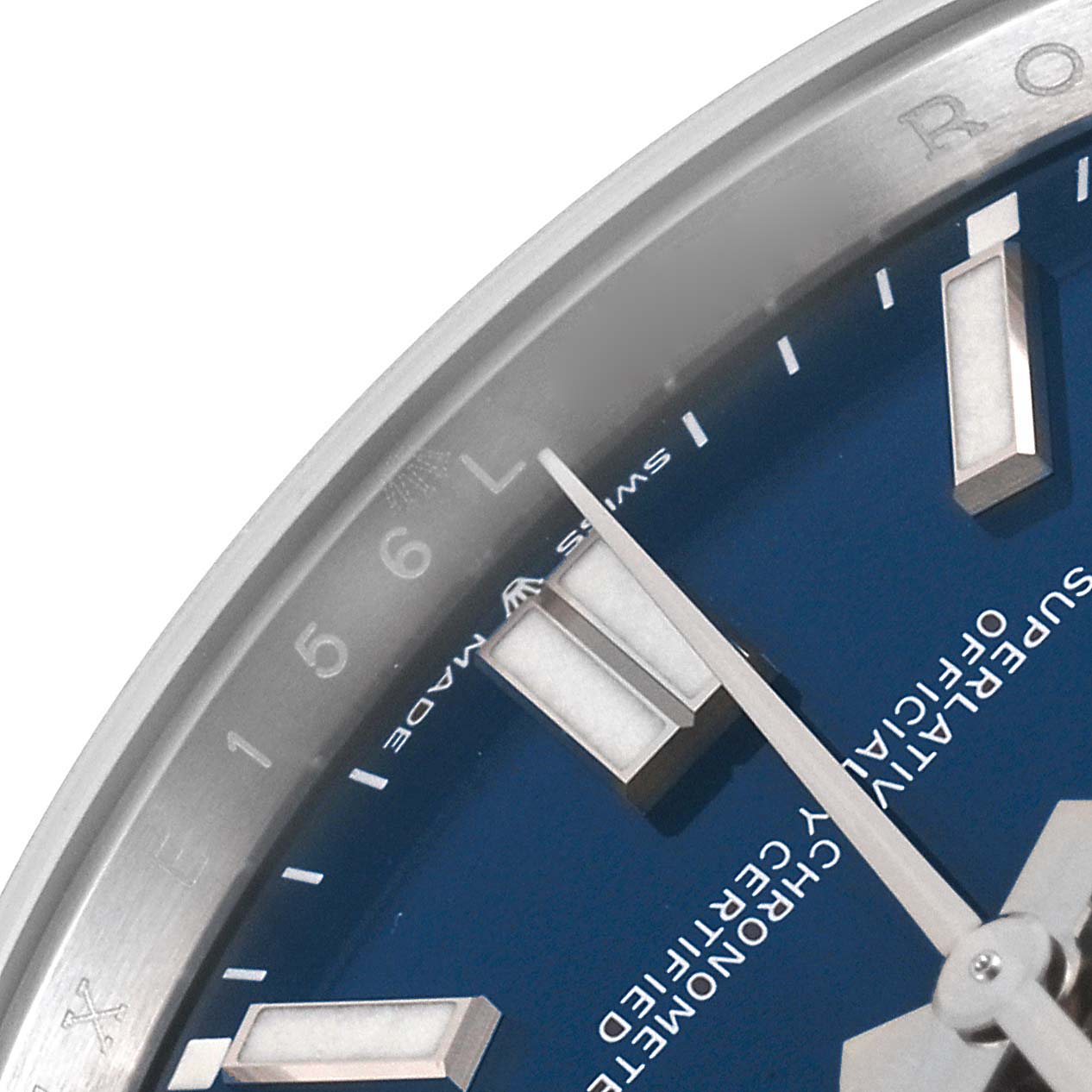 This image shows a close-up of the dial and hour markers of a Rolex Oyster Perpetual 124300 Men's Stainless Steel Blue Dial 124300 Men's Stainless Steel Blue Dial watch.