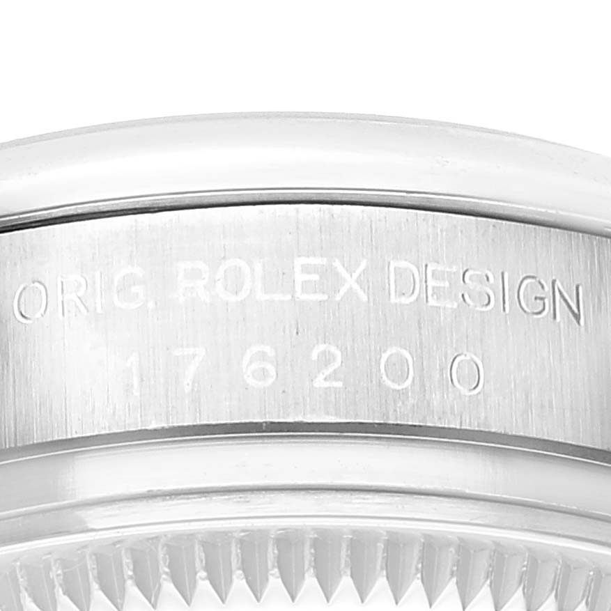 This image shows a close-up of the engraved side case of a Rolex Oyster Perpetual 176200 Women
s Stainless Steel Silver Dial 176200 Women
s Stainless Steel Silver Dial watch, highlighting the model number 176200.