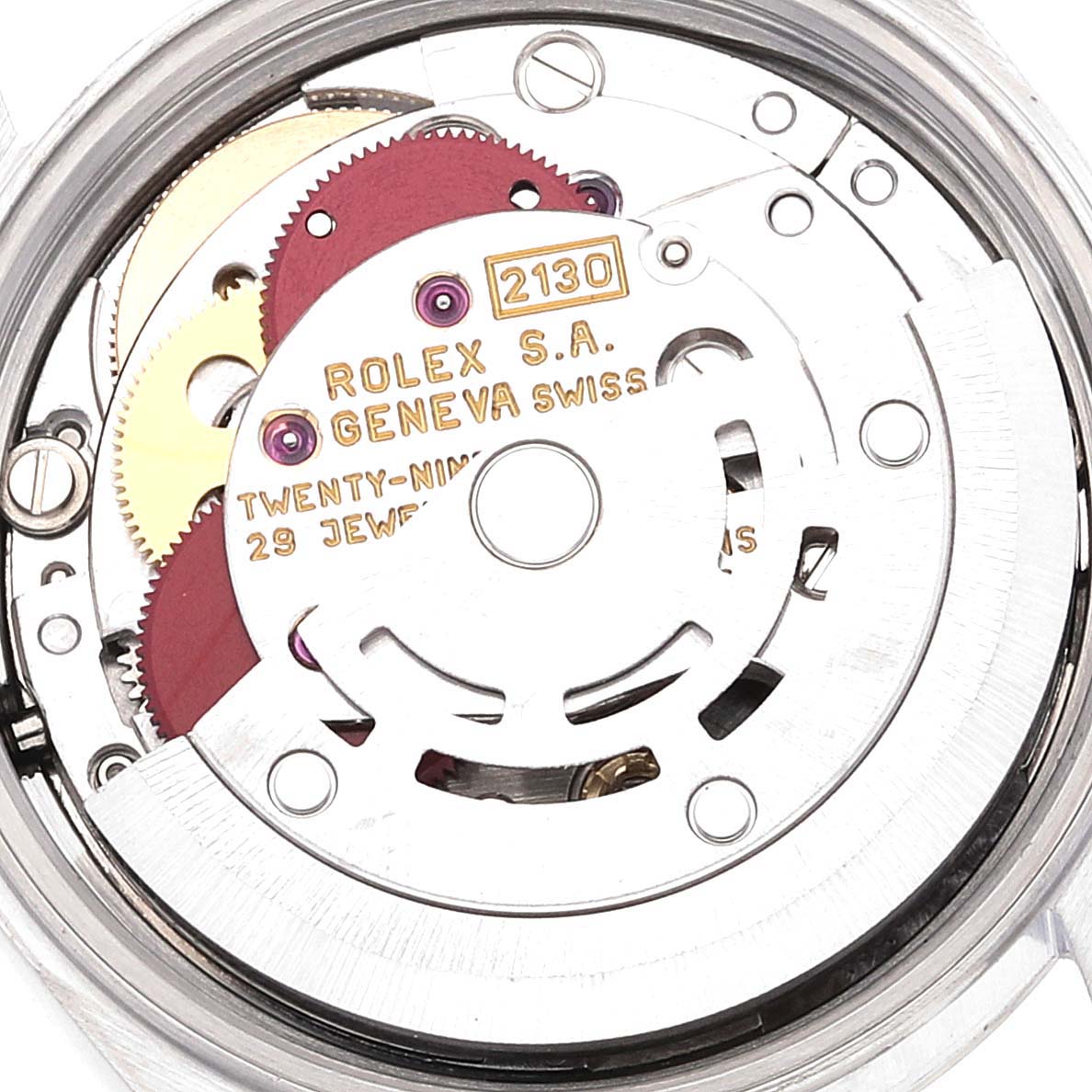 The image shows the internal mechanism of a Rolex Oyster Perpetual 67180 Women
s Stainless Steel Pink Dial 67180 Women
s Stainless Steel Pink Dial watch viewed from the back.