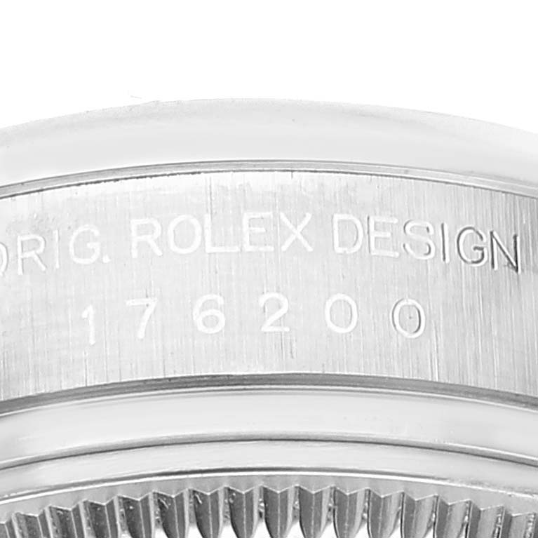 The close-up image shows the bezel and serial number engraving on a Rolex Oyster Perpetual 176200 Women's Stainless Steel Silver Dial 176200 Women's Stainless Steel Silver Dial watch.
