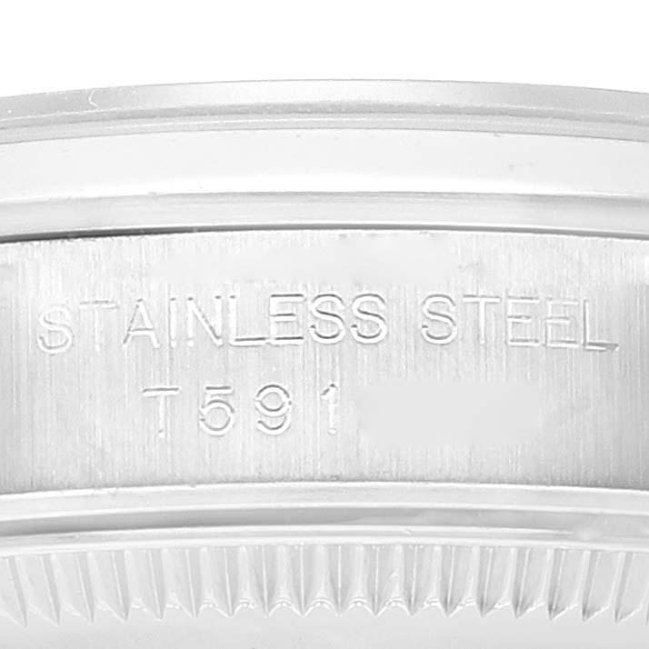 This image shows a close-up of the case back and engraving of the Rolex Oyster Perpetual 67180 Women's Stainless Steel Black Dial 67180 Women's Stainless Steel Black Dial watch.