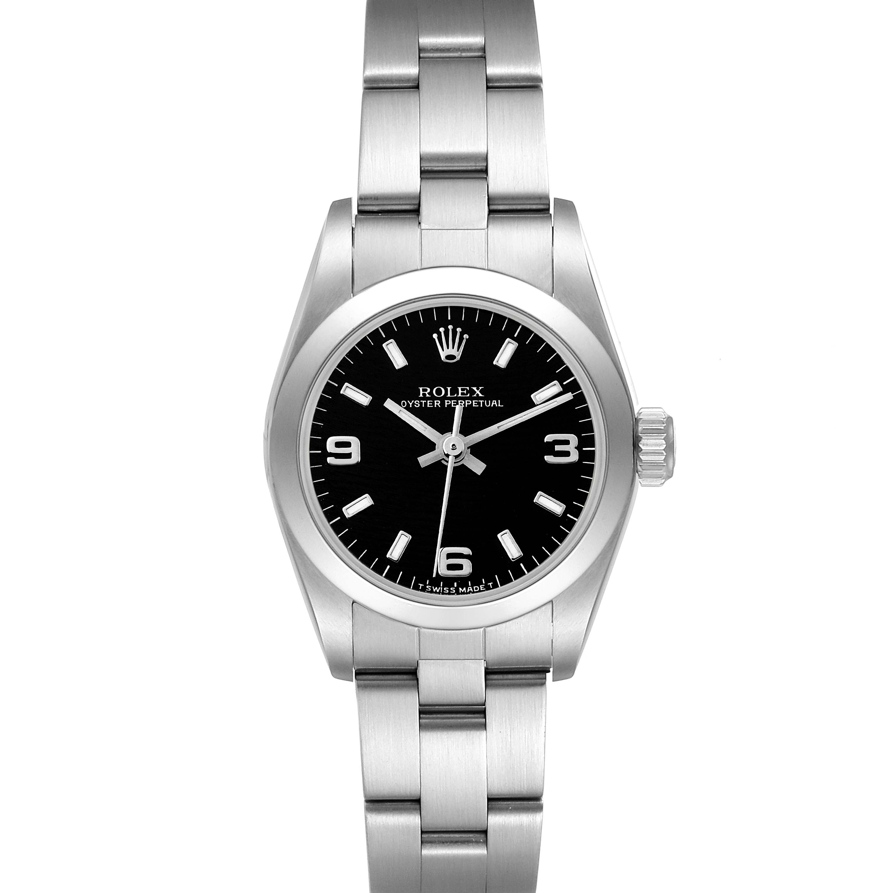 The image shows a front view of a Rolex Oyster Perpetual 67180 Women's Stainless Steel Black Dial 67180 Women's Stainless Steel Black Dial watch featuring its black dial, crown, and stainless steel bracelet.