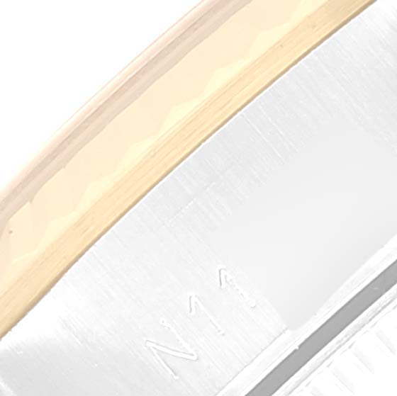 This close-up image shows the side view of the bracelet clasp of a Rolex Oyster Perpetual 67193 Women's Steel and Gold (two tone) Champagne Dial 67193 Women's Steel and Gold (two tone) Champagne Dial watch.