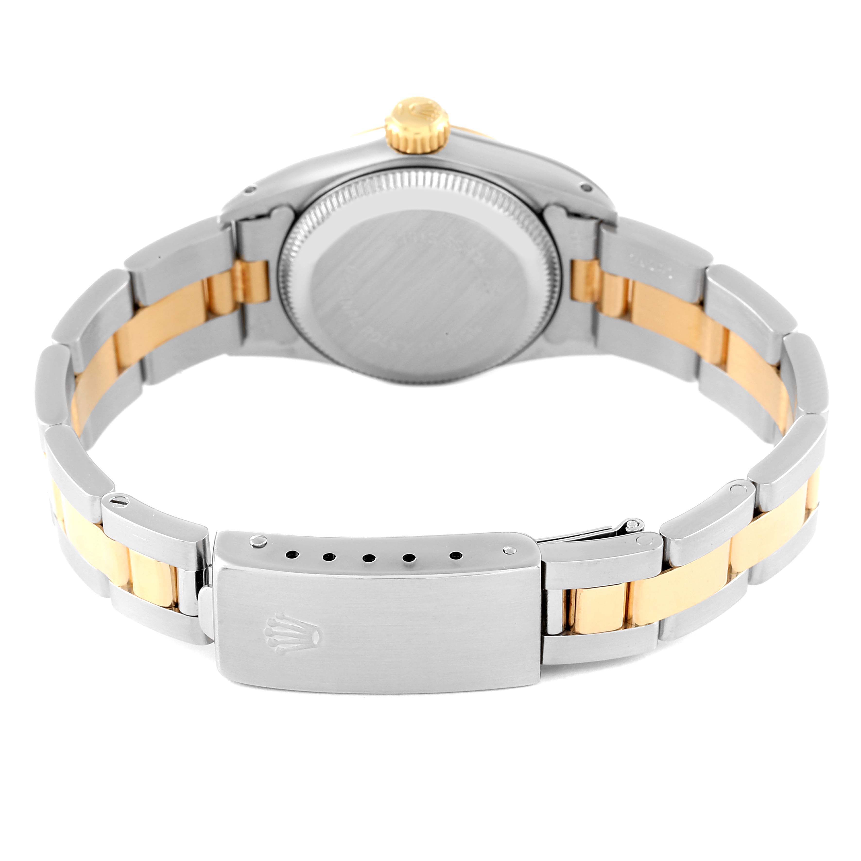 The image shows the back angle of a Rolex Oyster Perpetual 67193 Women's Steel and Gold (two tone) Champagne Dial 67193 Women's Steel and Gold (two tone) Champagne Dial watch, highlighting the case back and bracelet clasp.