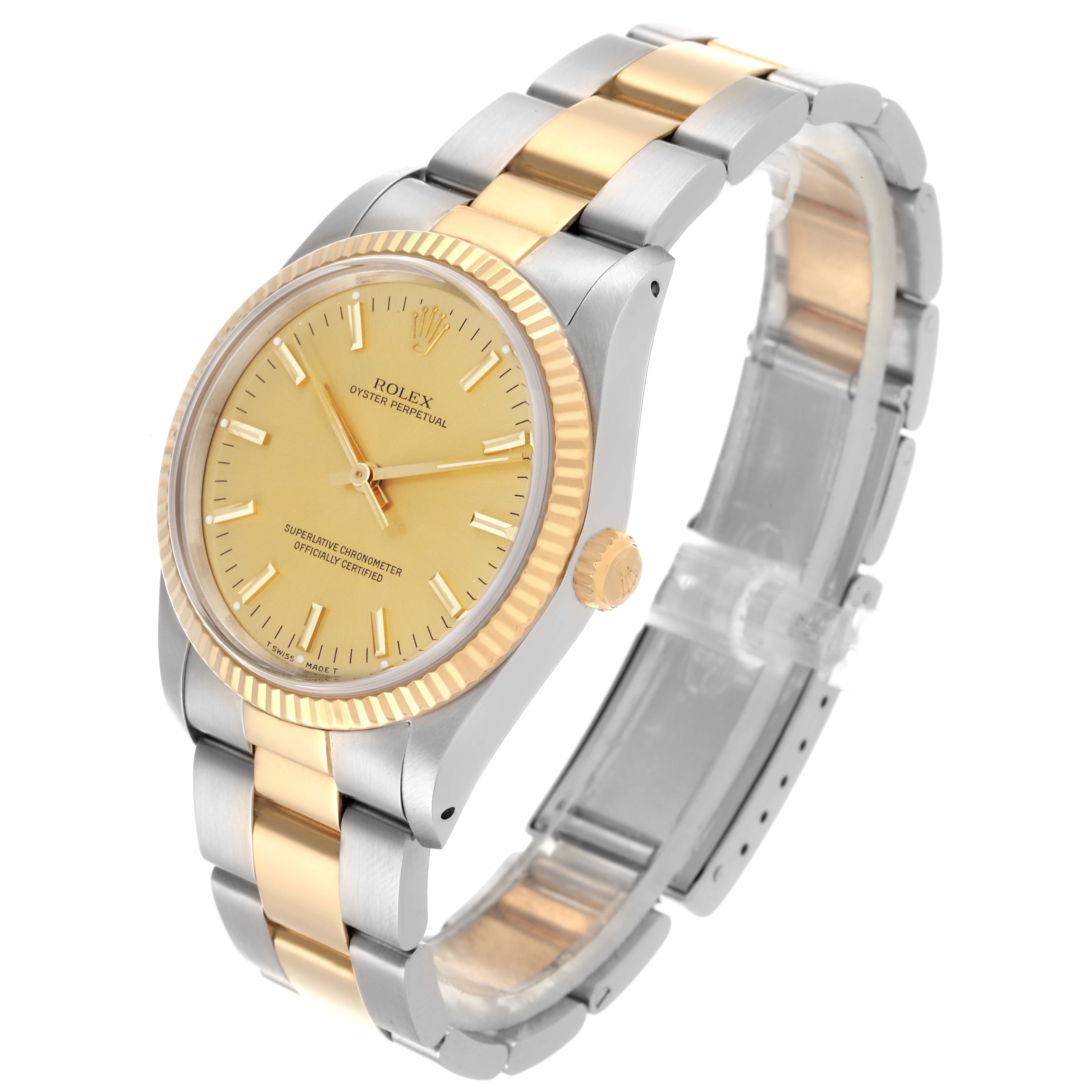 The Rolex Oyster Perpetual 14233 Men's Steel and Gold (two tone) Champagne Dial 14233 Men's Steel and Gold (two tone) Champagne Dial watch is shown from an angled side view, highlighting its yellow gold bezel and two-tone bracelet.