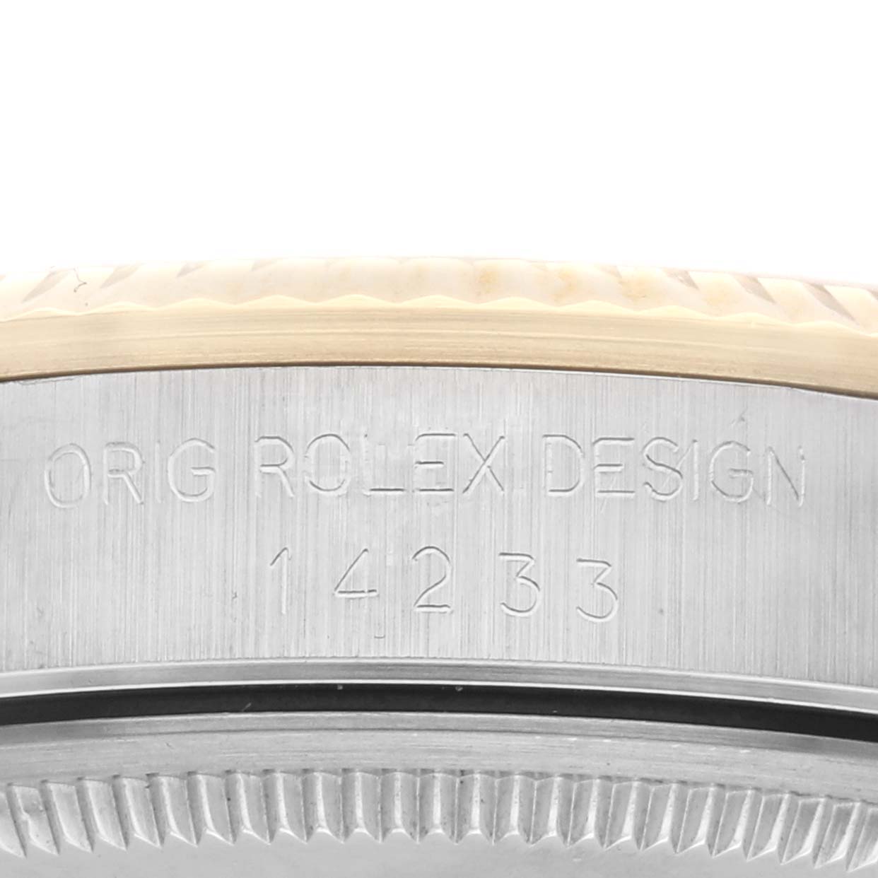 The image shows the side engraving and fluted bezel of a Rolex Oyster Perpetual 14233 Men's Steel and Gold (two tone) Champagne Dial 14233 Men's Steel and Gold (two tone) Champagne Dial watch.
